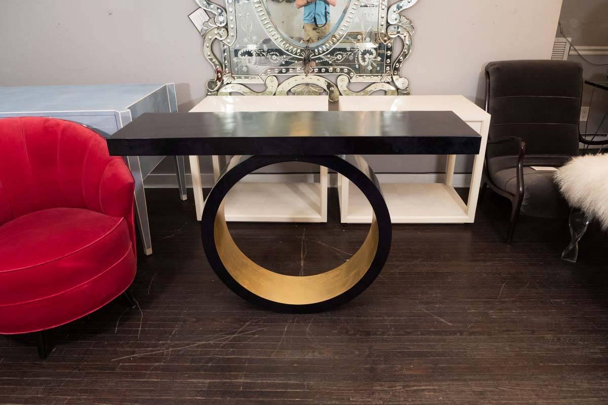 Custom black parchment wall-mounted circle console with gold leaf. Custom orders are available for different sizes and parchment colors.