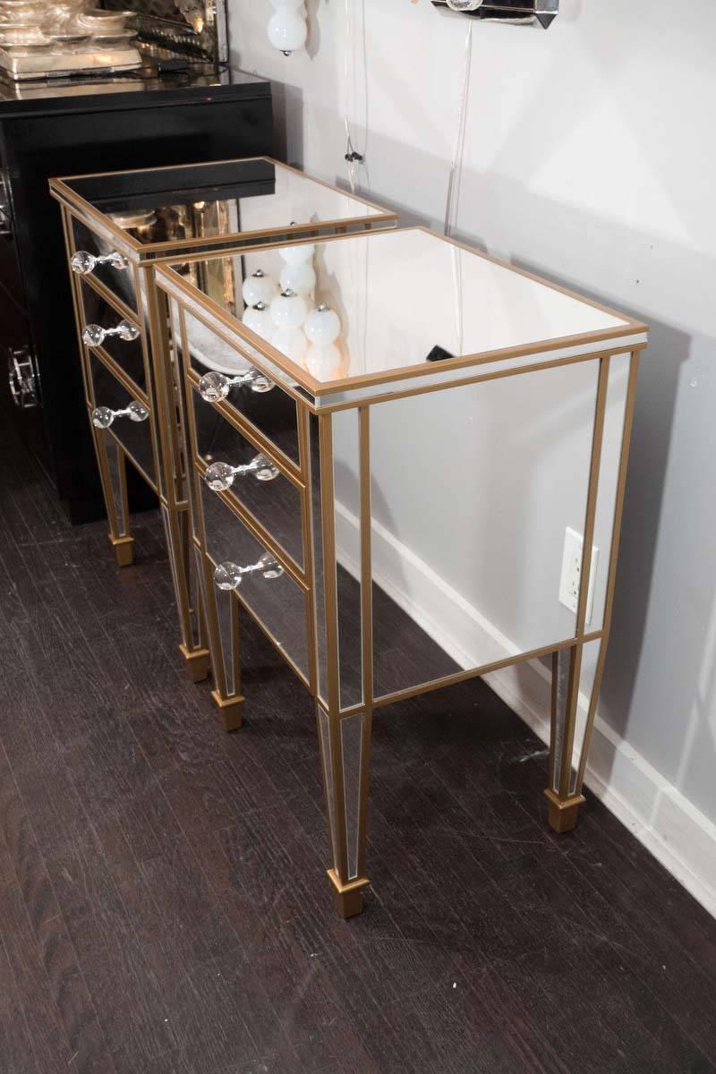 Pair of 3-drawer custom gold trim mirrored nightstands. Finished in starphire/clear mirror,and with gold  wood trims and glass hardware. Customization is available in different sizes, finishes and hardware.
 