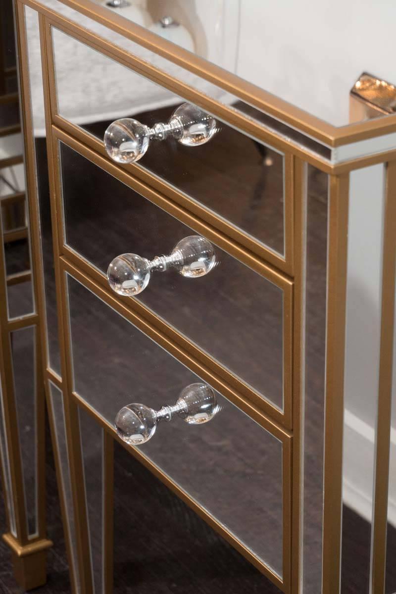 mirrored nightstand with gold trim