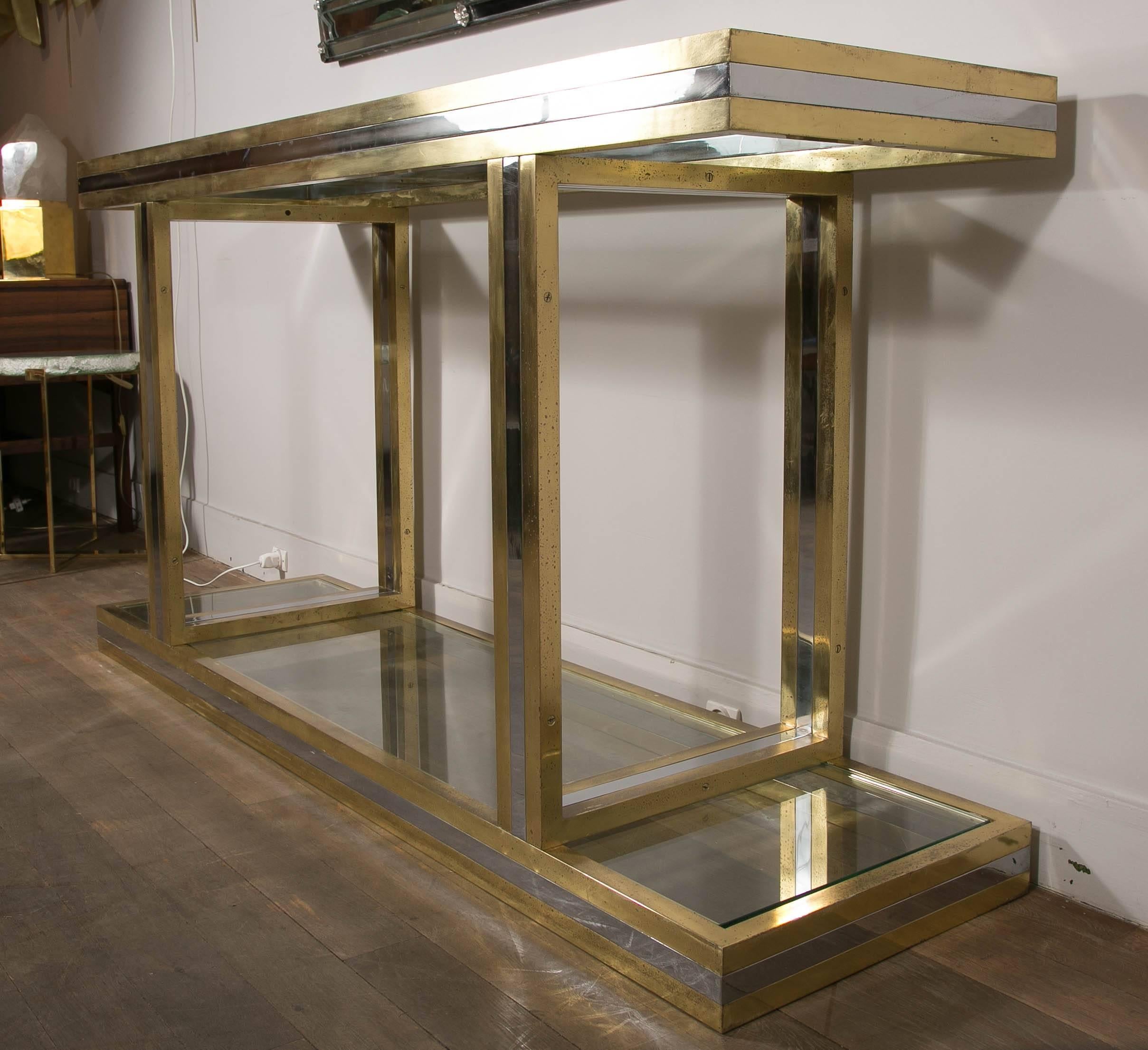 Console made in brass and chromed metal, with two glass shelves.
Design: Romeo Rega,
Italy, circa 1970.
    