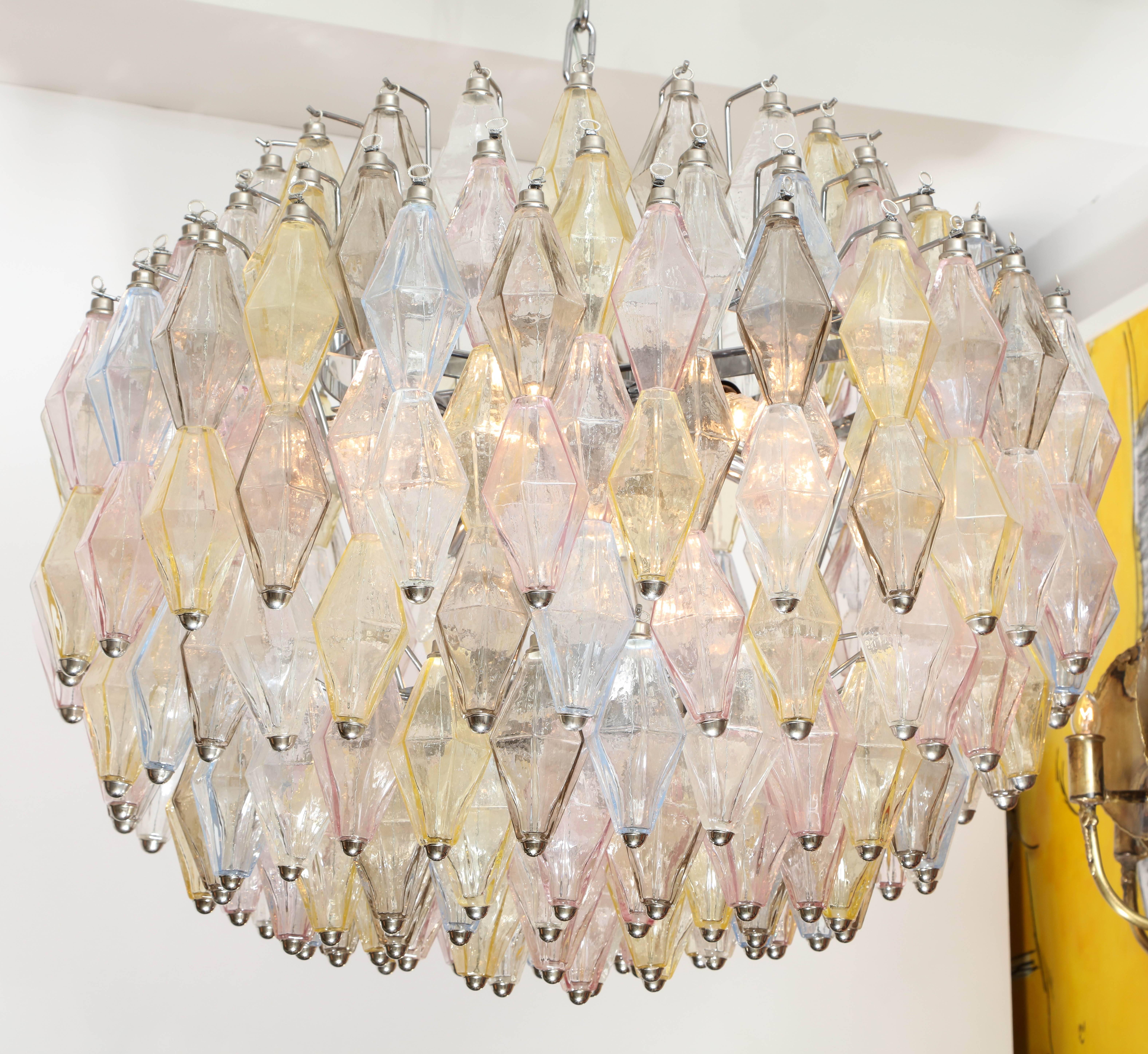 Decorative large multicolor polyhedral glass chandelier with chrome frame. 
Light yellow, pink, blue, smoke and clear colors.
Murano, Italy.