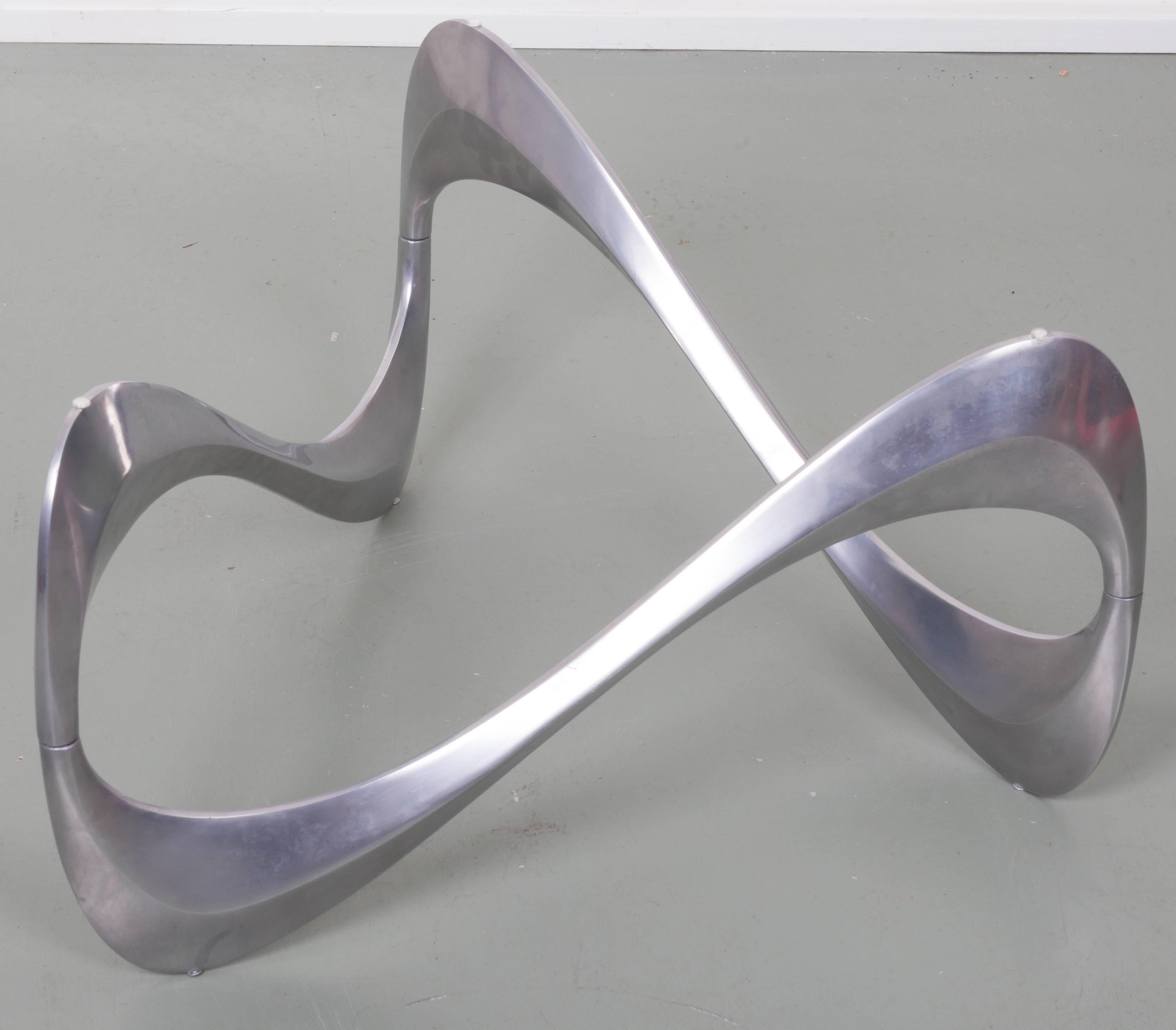 Aluminum and glass snake coffee table by Knut Hesterberg for Ronald Schmitt.
Base measures 27