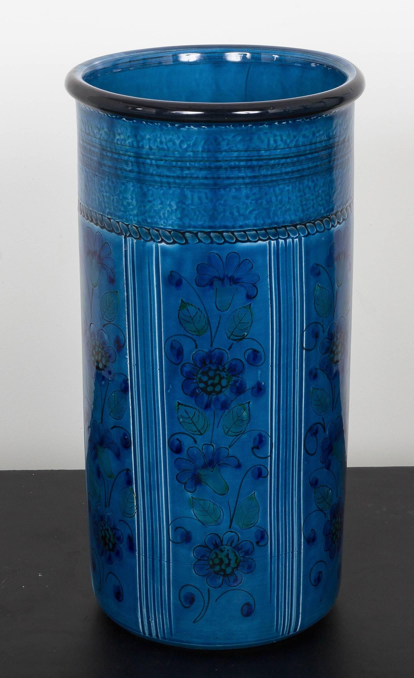 Vibrant blues, greens and turquoise glazed umbrella stand with hand-painted stylized floral design.