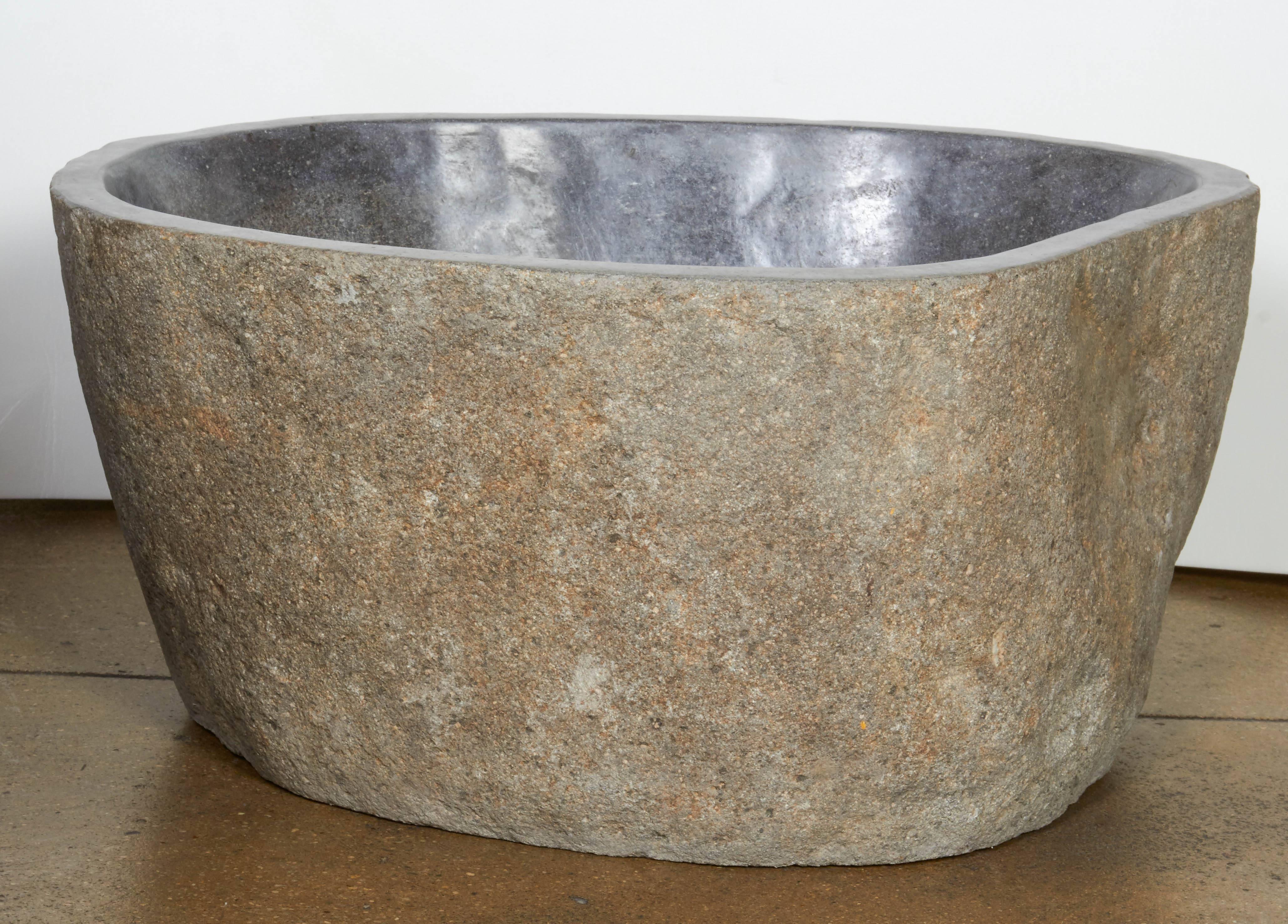 A large carved stone basin or bowl with polished interior. Great to convert into a sink. Smaller sizes available.