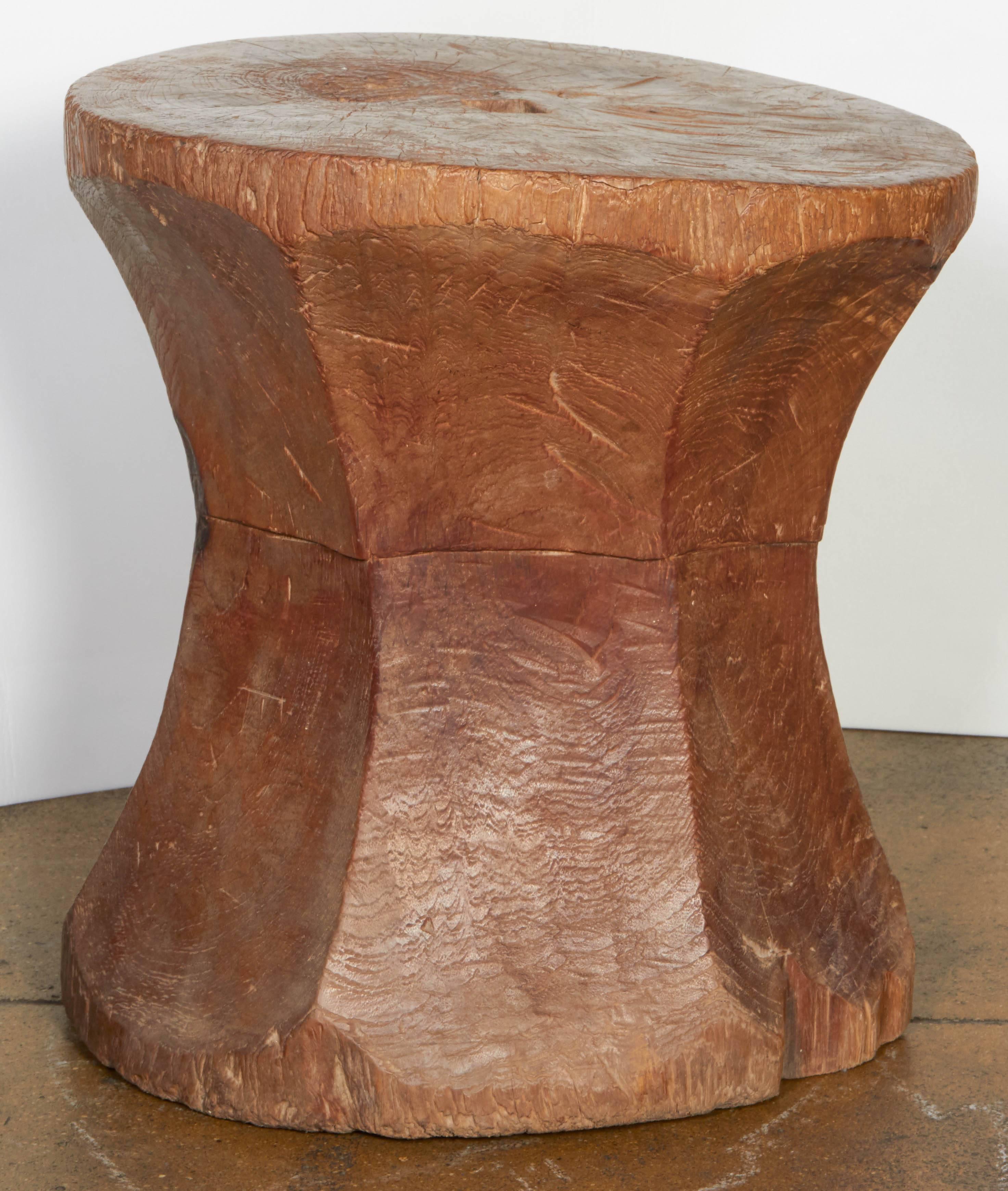 A hand-carved teakwood end table from Indonesia. Natural finish.