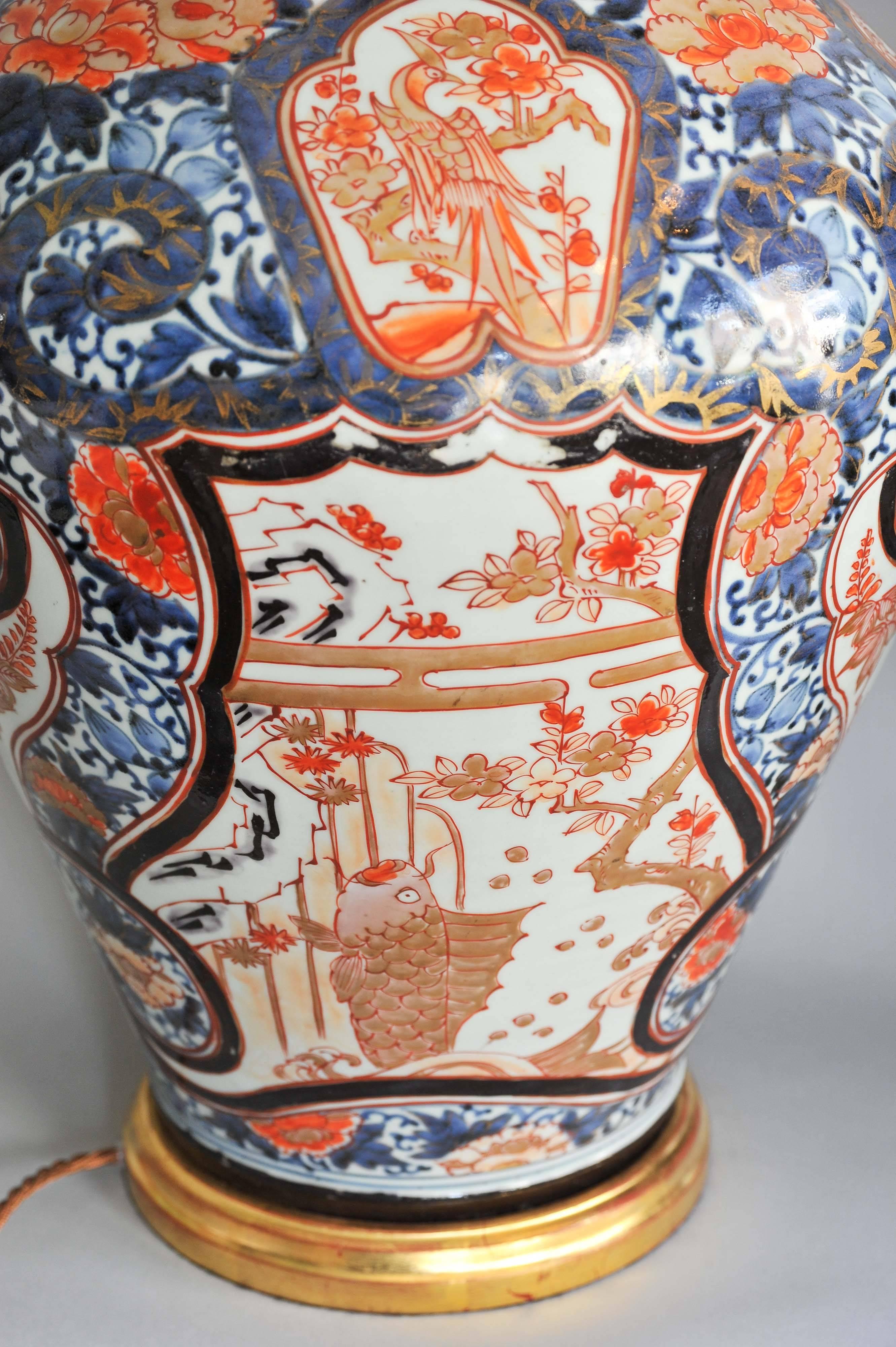 A Fine Pair of Early 18th Century Lamped Imari Vases on Gilt Bases 2