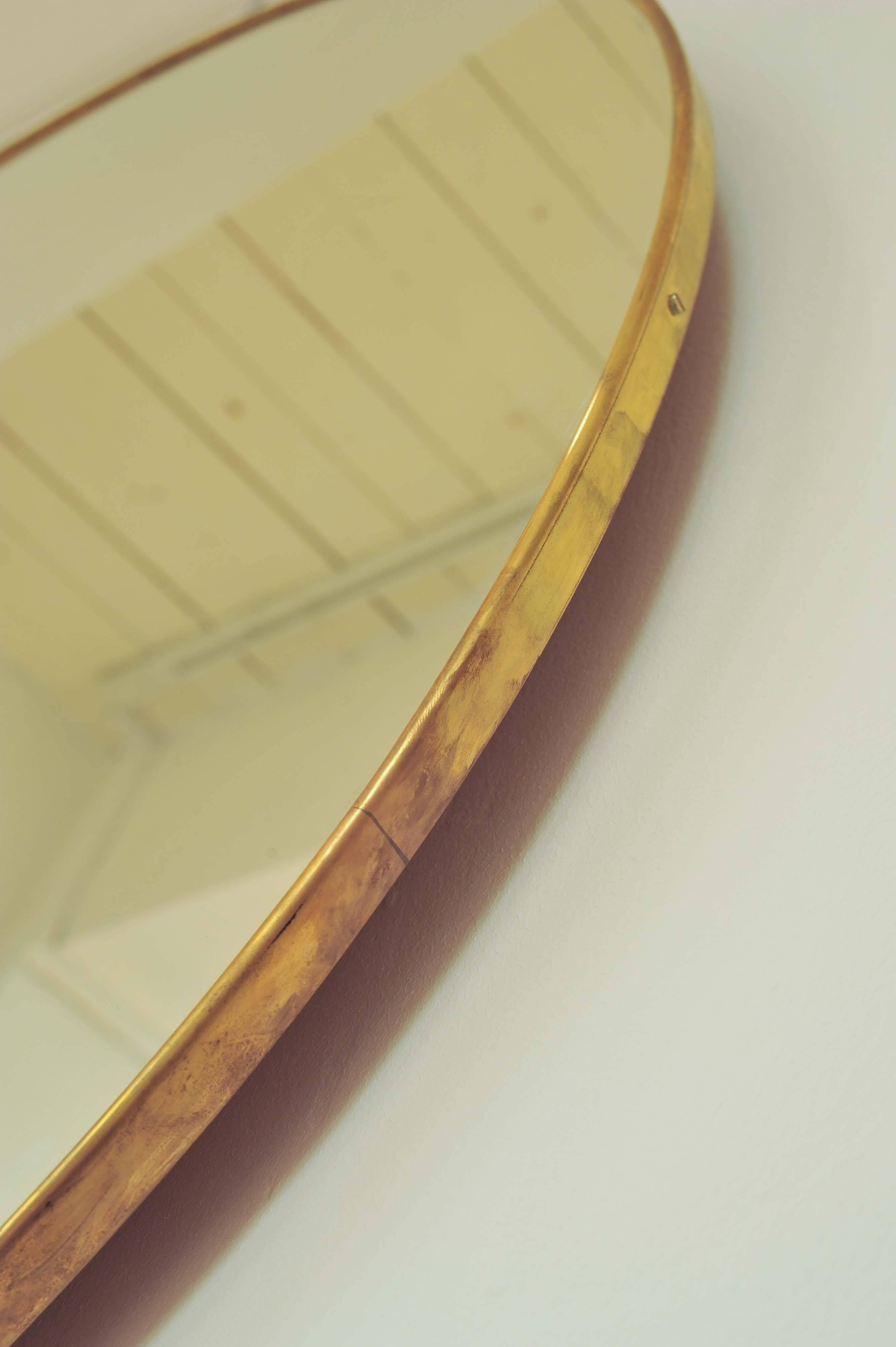 large brass round mirror