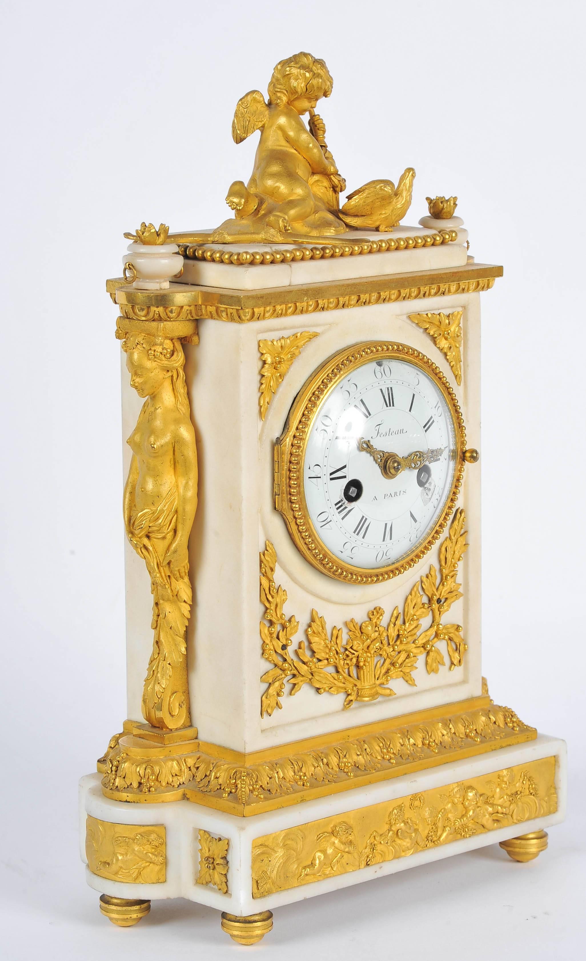A fine quality French 19th century gilded ormolu and white marble mantel clock, signed Festeau of Paris. Having a cherub with a bow and arrow on top, the enameled clock face with eight day chiming movement. A pair of caryatids mounted on either side
