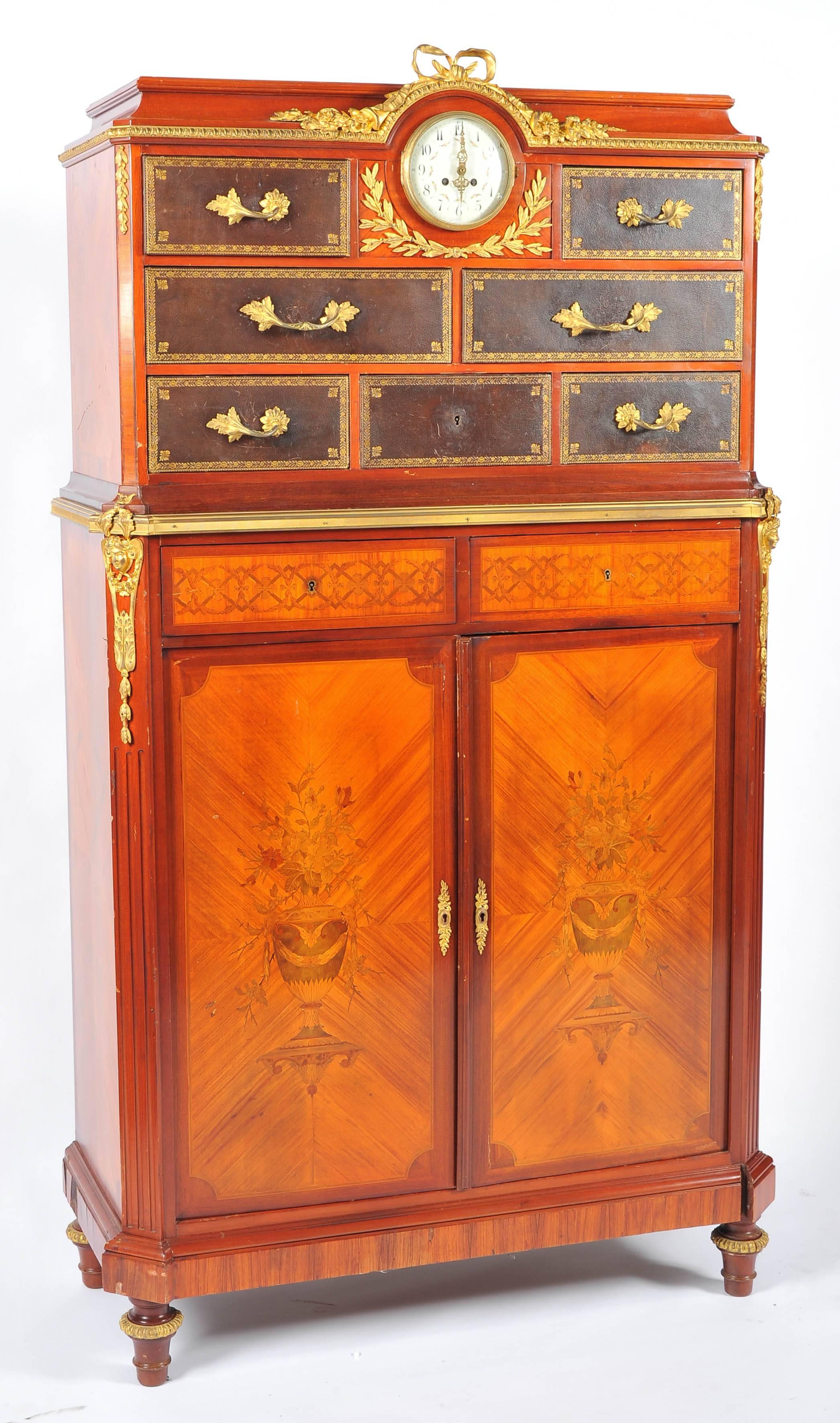 A very good quality French kingwood marquetry inlaid, ormolu-mounted side cabinet, having an inset clock, leather drawers beneath and two inlaid doors opening to reveal adjustable shelves.