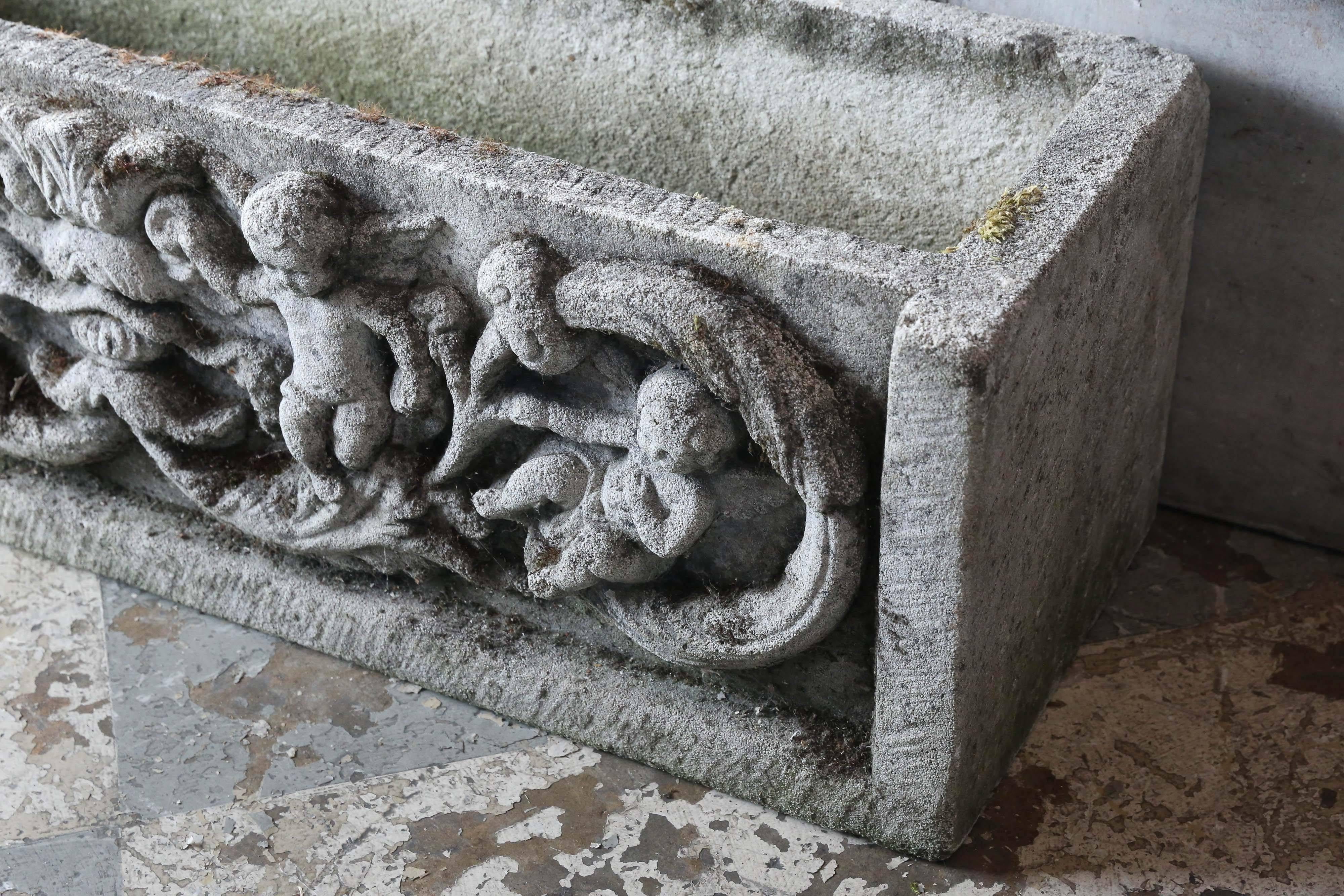 A lovely find in the French countryside just north of Paris, we just love this heavy concrete stone planters with the relief of four very special angels along the front, two available.

Exterior measurements: 11.5
