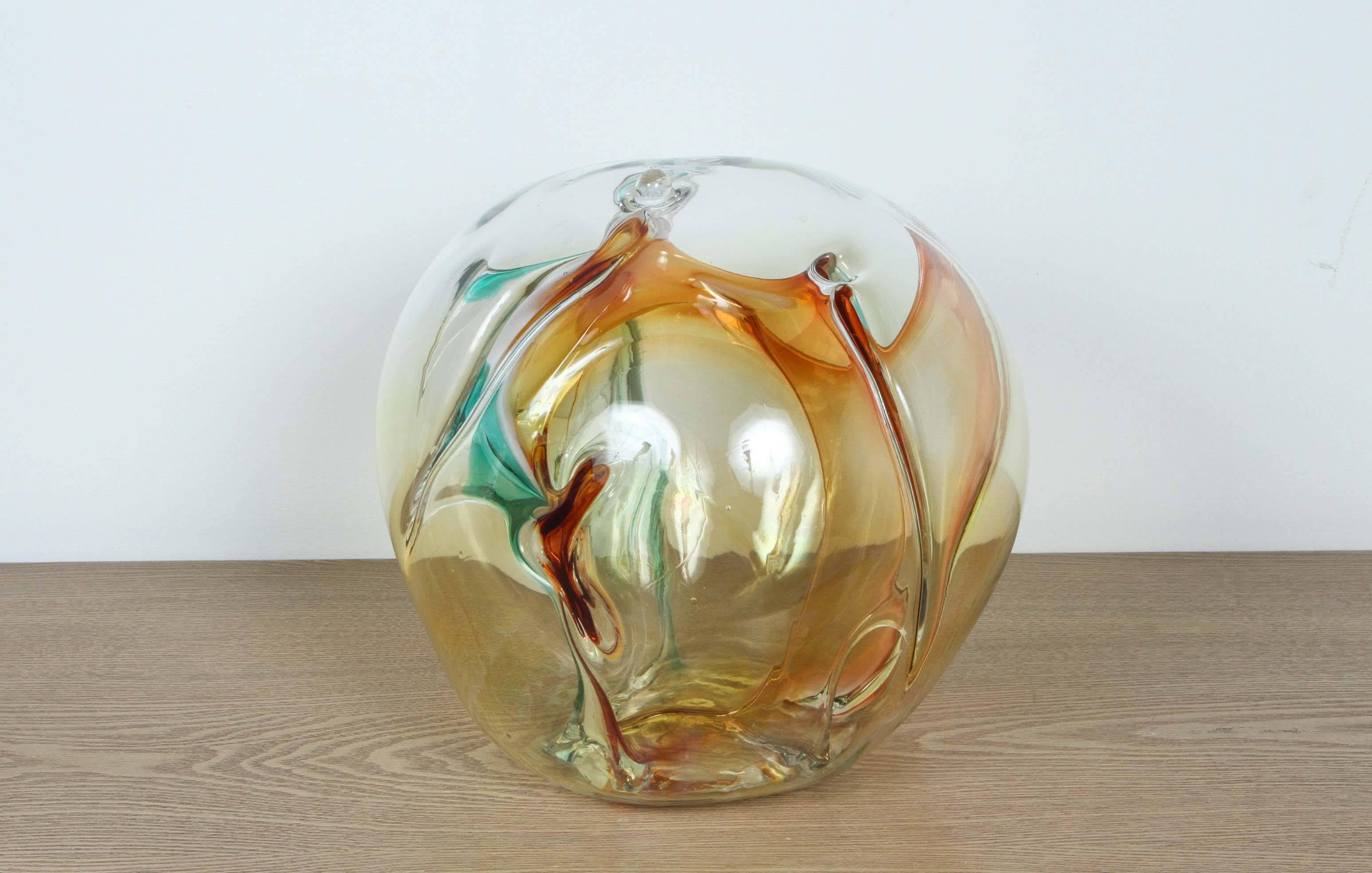 Beautiful handblown glass sculpture by Peter Bramhall.
The handblown glass has amber tones along with shades of aqua and white.
Signed and dated 1996.
  