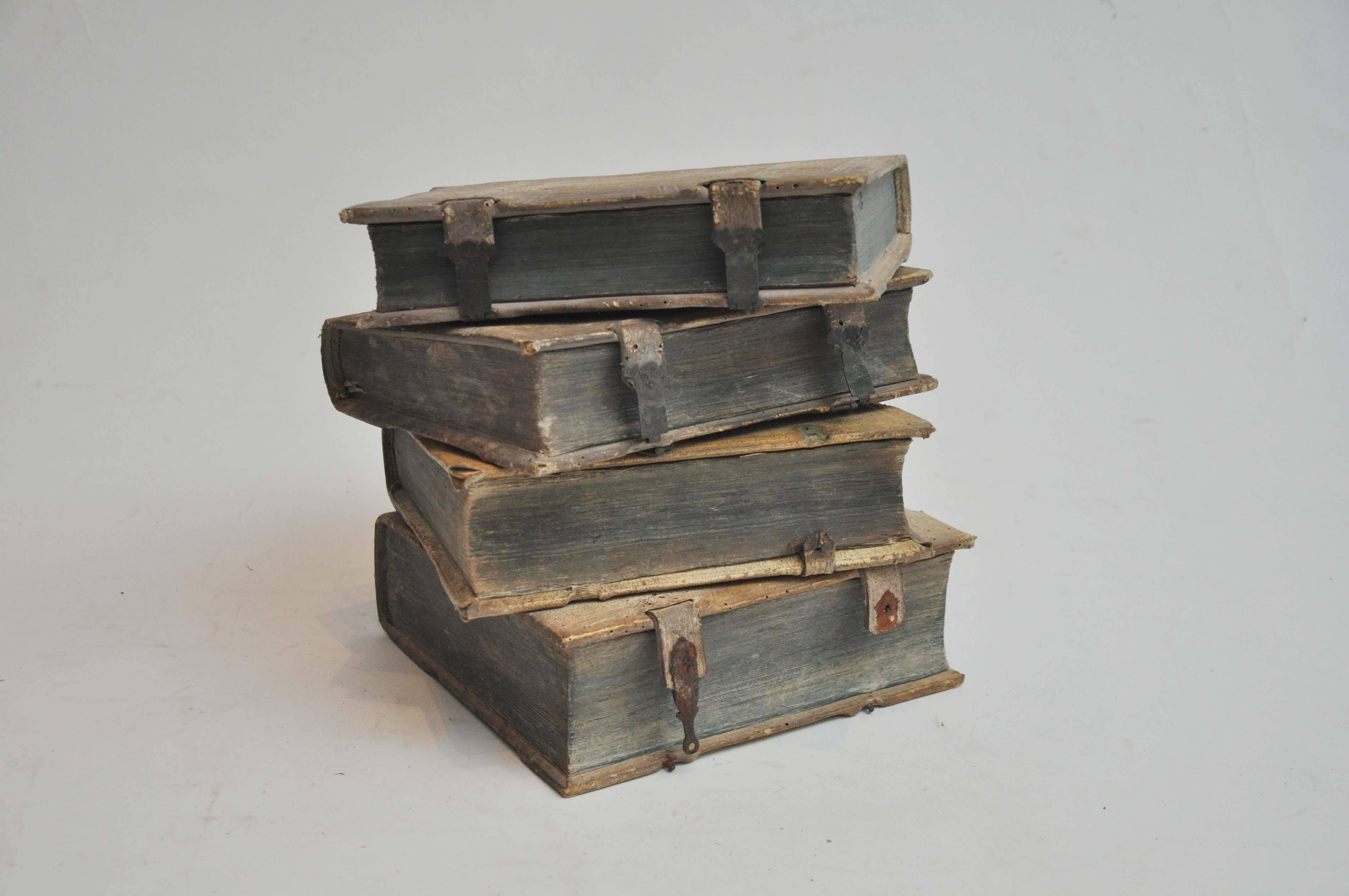 17th Century Collection of Four Rare European Vellum Books with Buckles Books found in Germany. 

These books have aged beautifully with exquisite patina and dark teal page edges.

Vellum (derived from the Latin word vitulinum meaning 