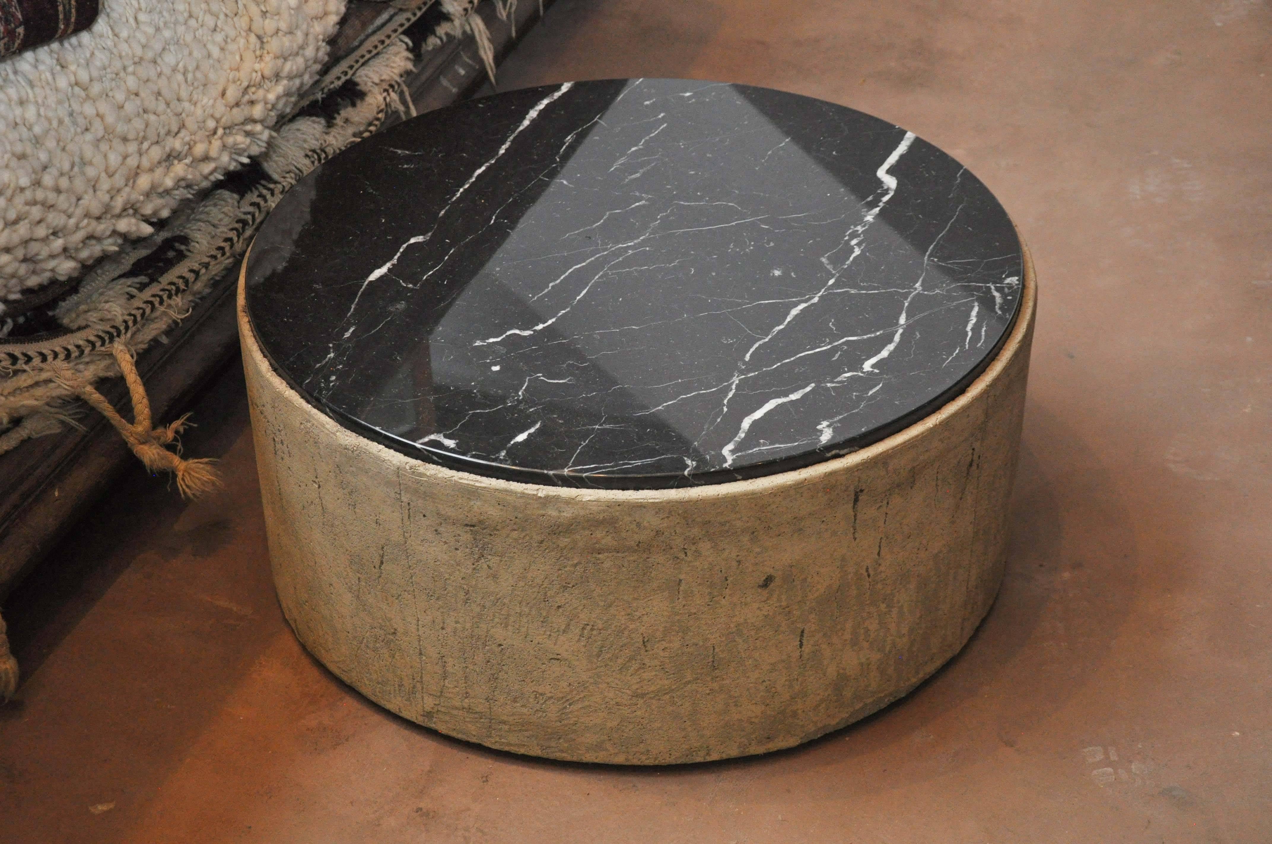 21st Century Custom Concrete and Marble Coffee Table. Rough concrete table base shown with black marble top. Unique blend of rough and refined, one of a kind. 

Dimensions: 30" diameter x 13.5"h