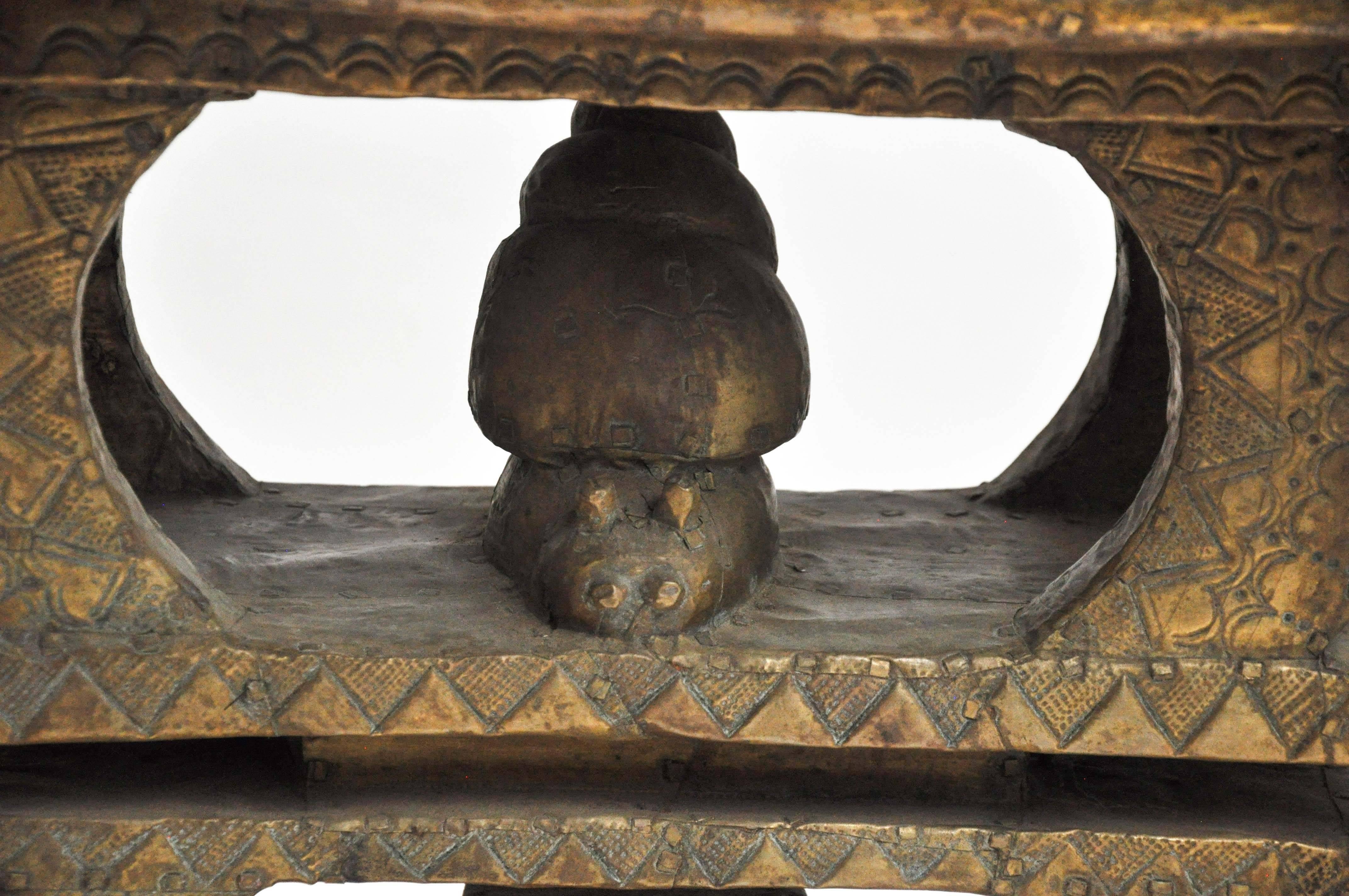 Early 20th century peace stool from Ghana 'Ashanti' in etched brass.

Stools existed previously as traditional symbols of chieftaincy.
Peace stools in particular were used post war for signing peace treaties and agreements.

Early history - When