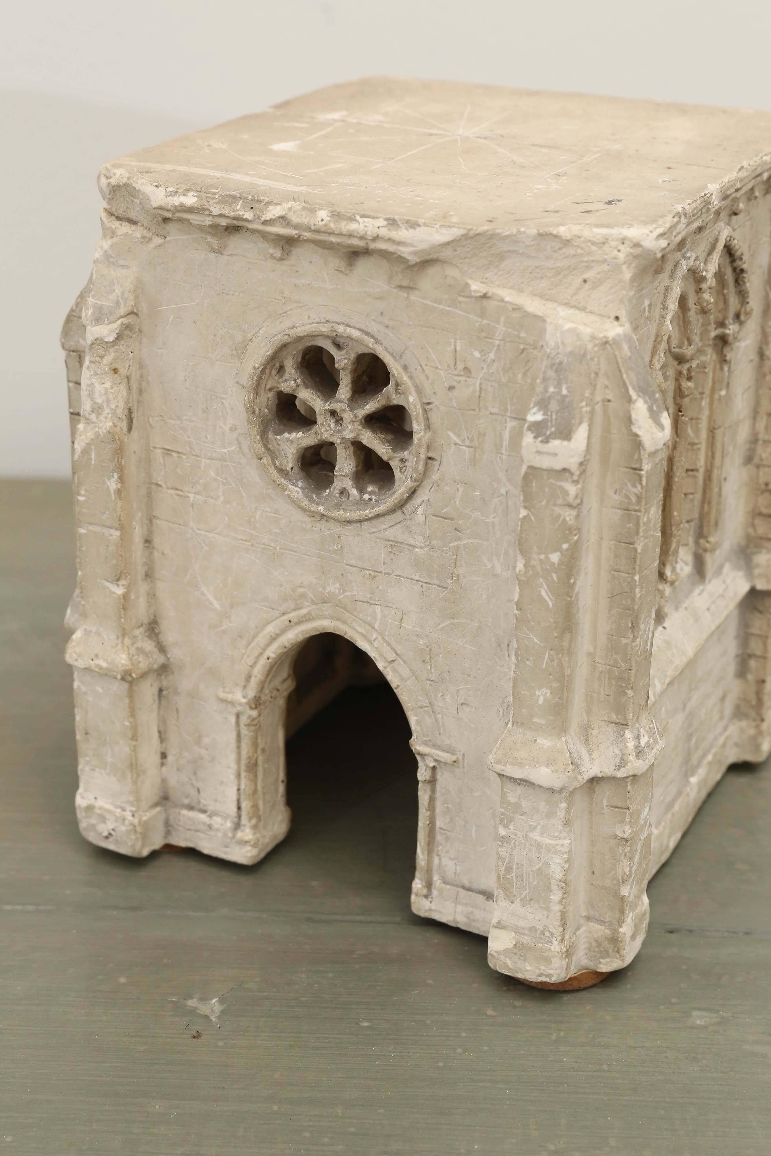 18th century architect's plaster model of a baroque church with the arched windows and the rose window above the main entrance.