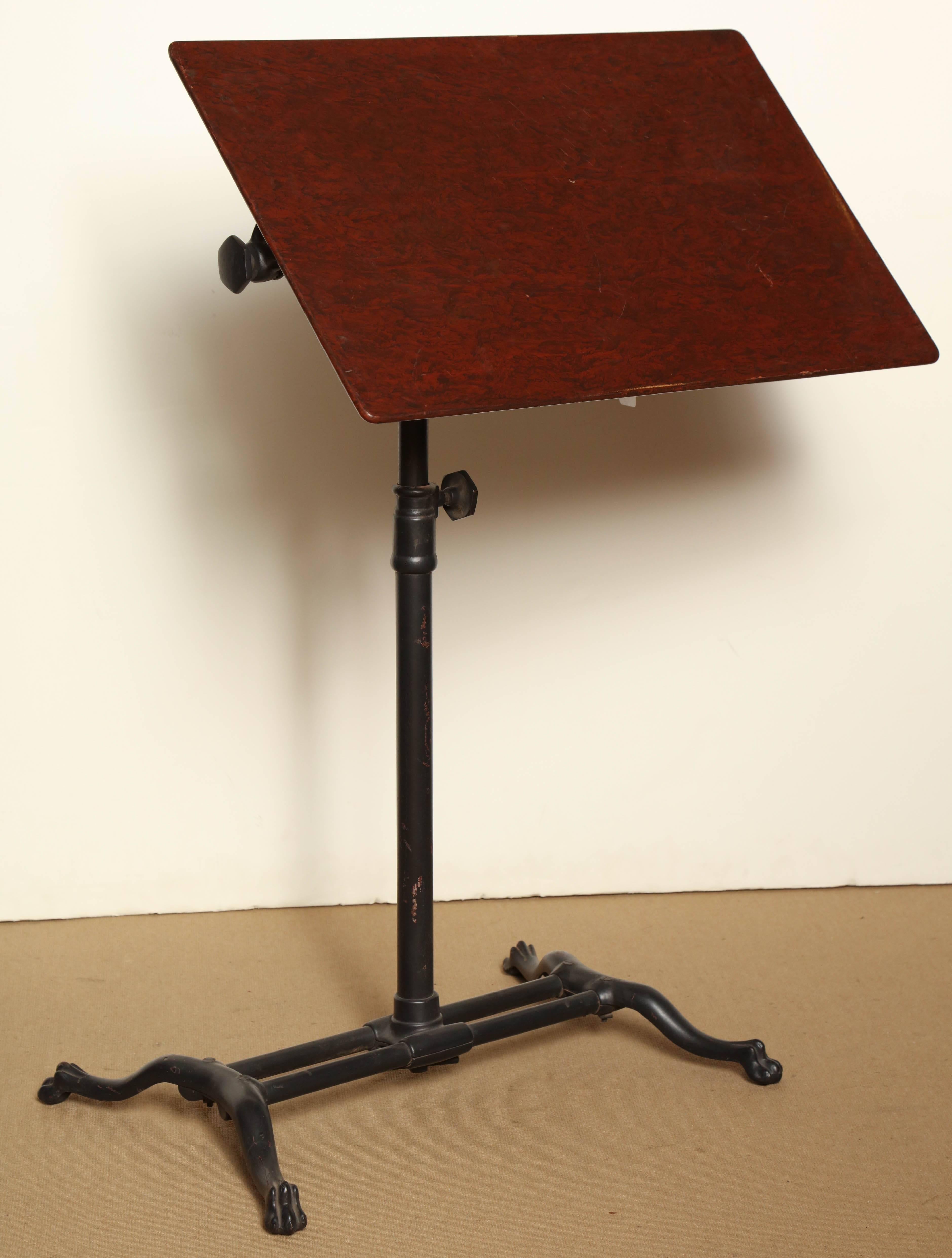 English Victorian, adjustable bedside table of iron and wood.