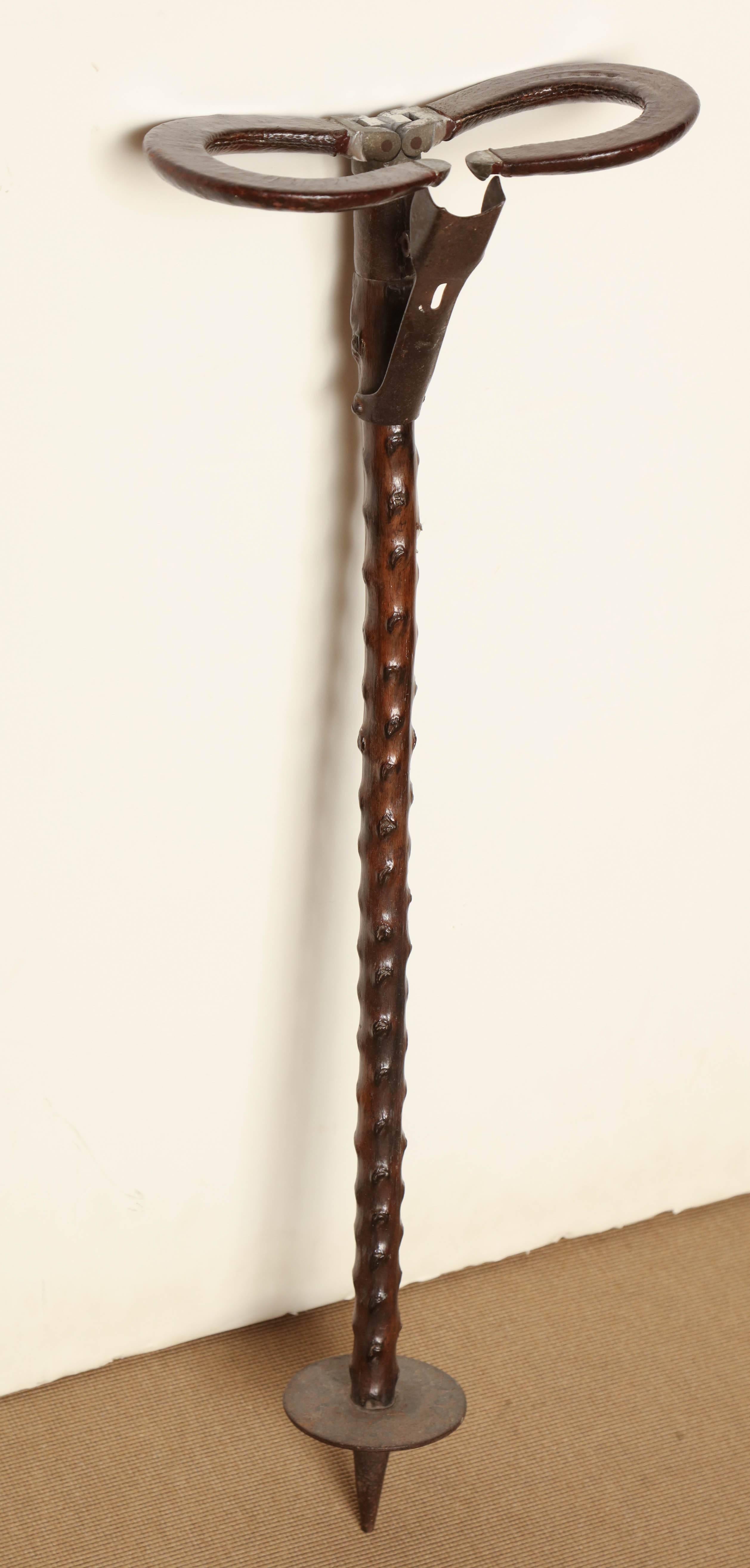 Mid-19th century shooting stick.
Folding handle wrapped in leather on a briar shaft.
