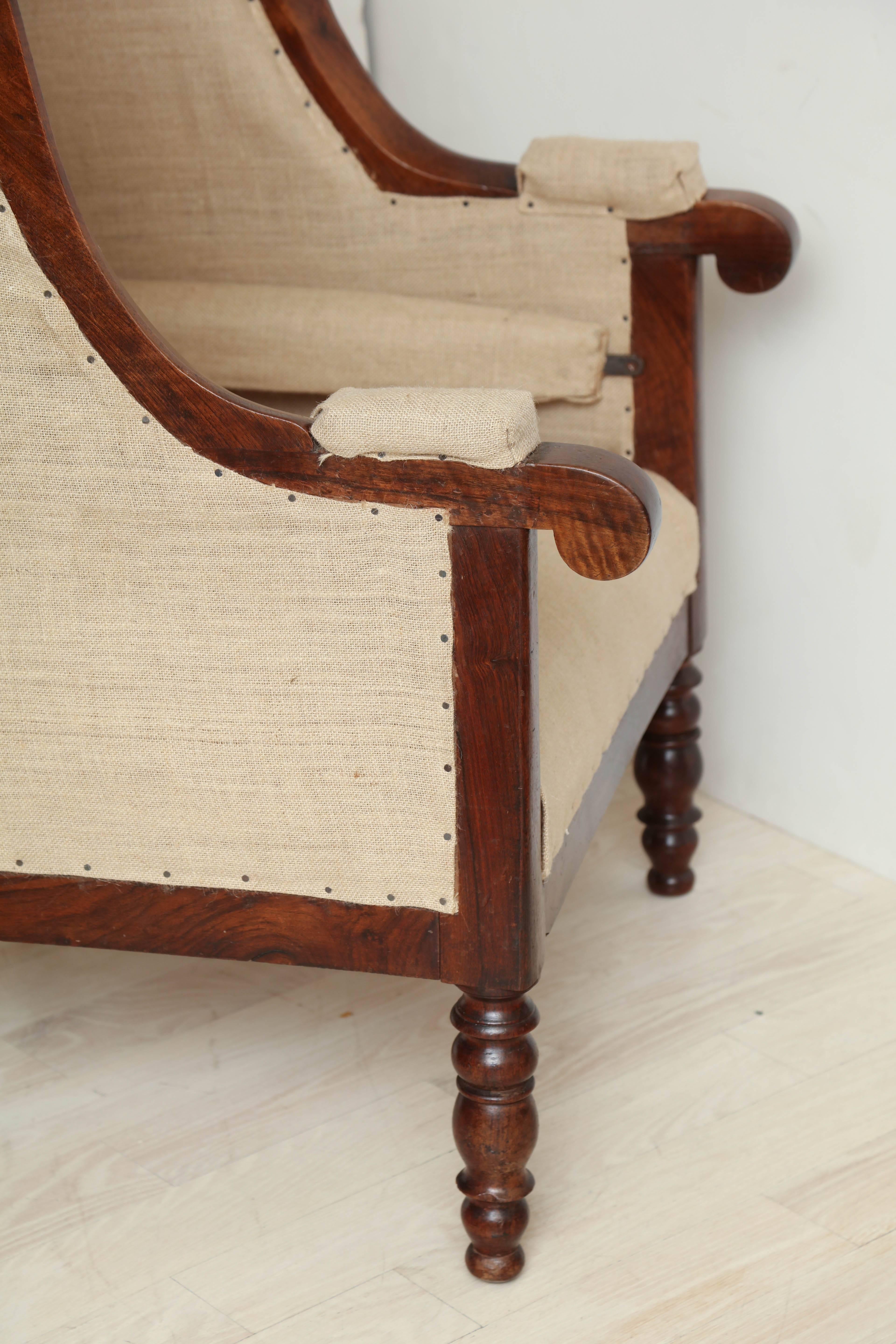 Early 19th Century French Walnut Upholstered Wing Chair For Sale 3