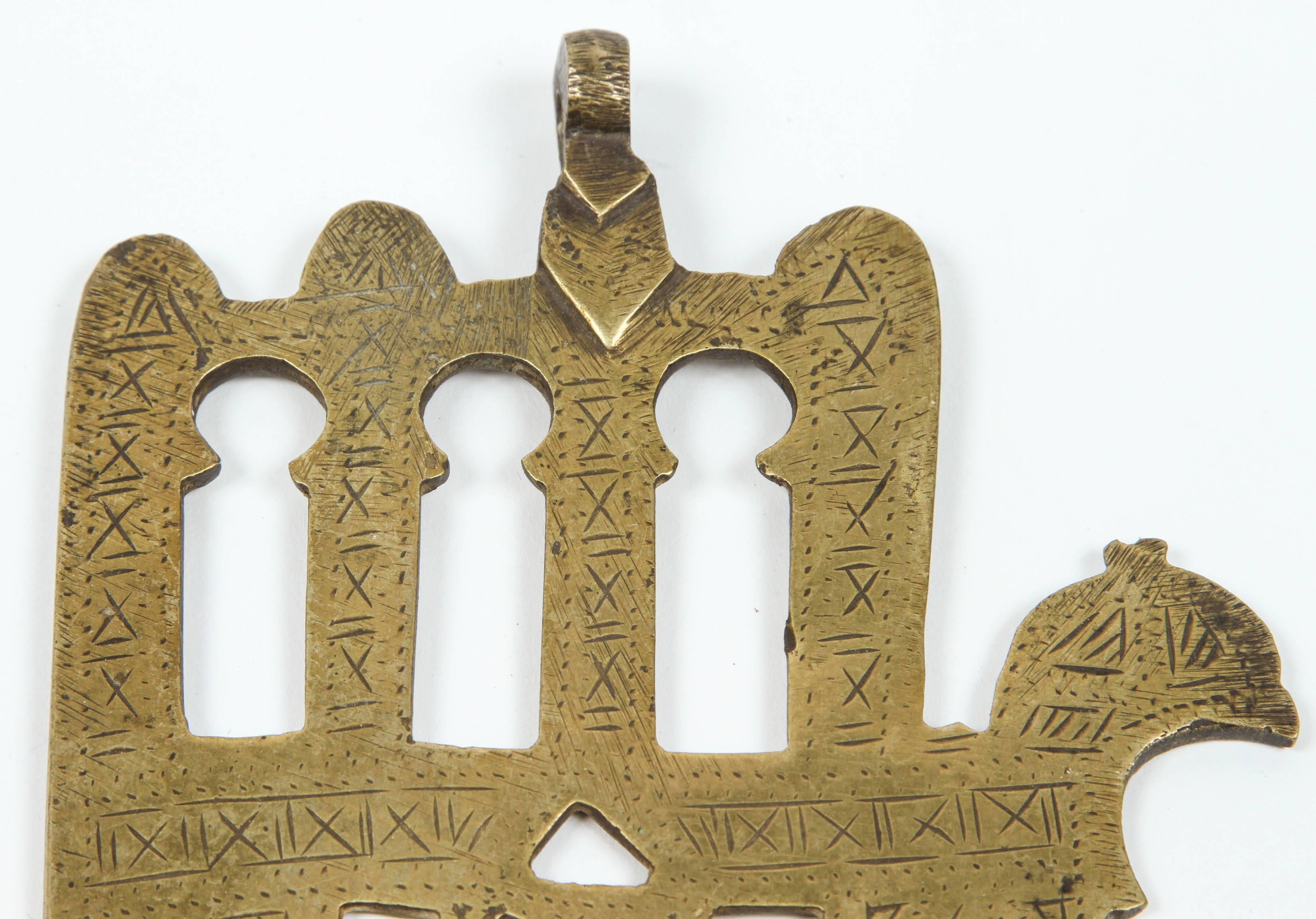 Moroccan Jewish Judaica brass khamsa. (Hand of Fatima) This beautiful piece of folk brass art originates from Morocco, North Africa. The Judaica khamsa is a rare version - with only one finger spread out - rather than two as it is with the most ones