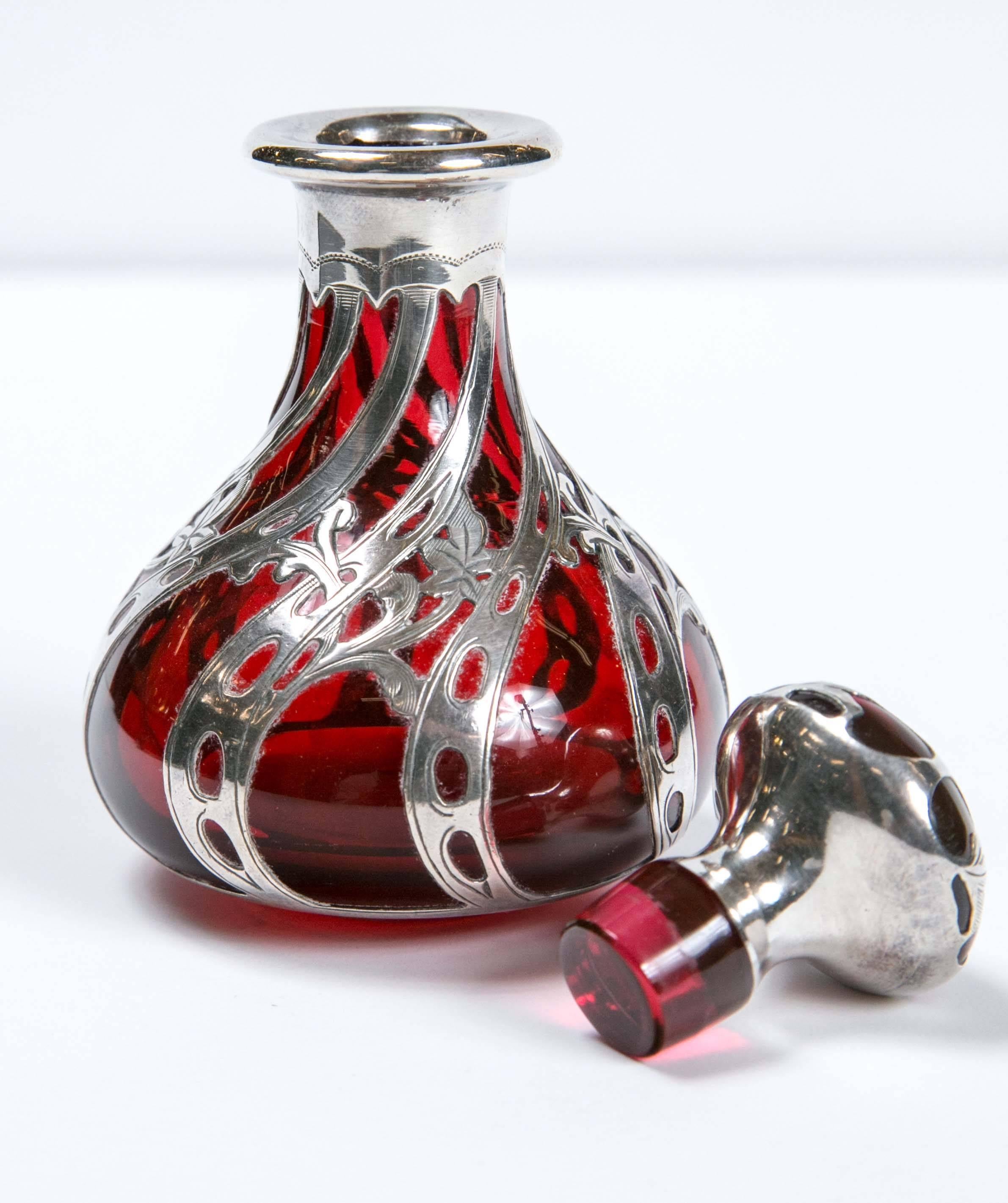 Gorgeous American antique sterling silver overlay ruby red perfume bottle.
All sterling silver overlay in perfect condition and bottle as well. Perfect to add any vanity.