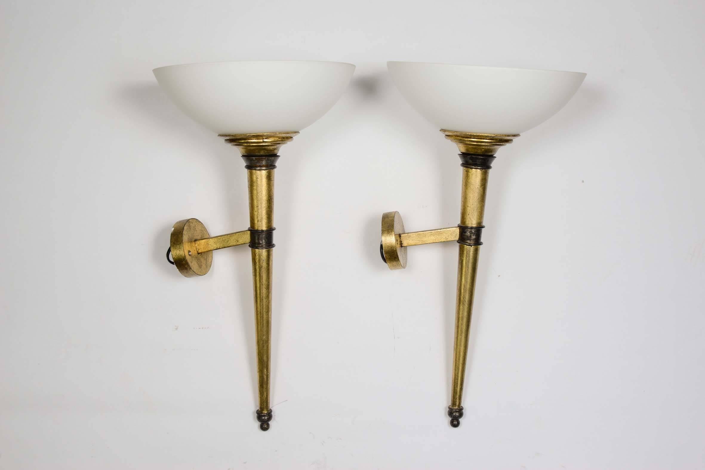 Set of four wall sconces, arms in bronze with gold foil, cup in white glass, made by BFA creation / France.