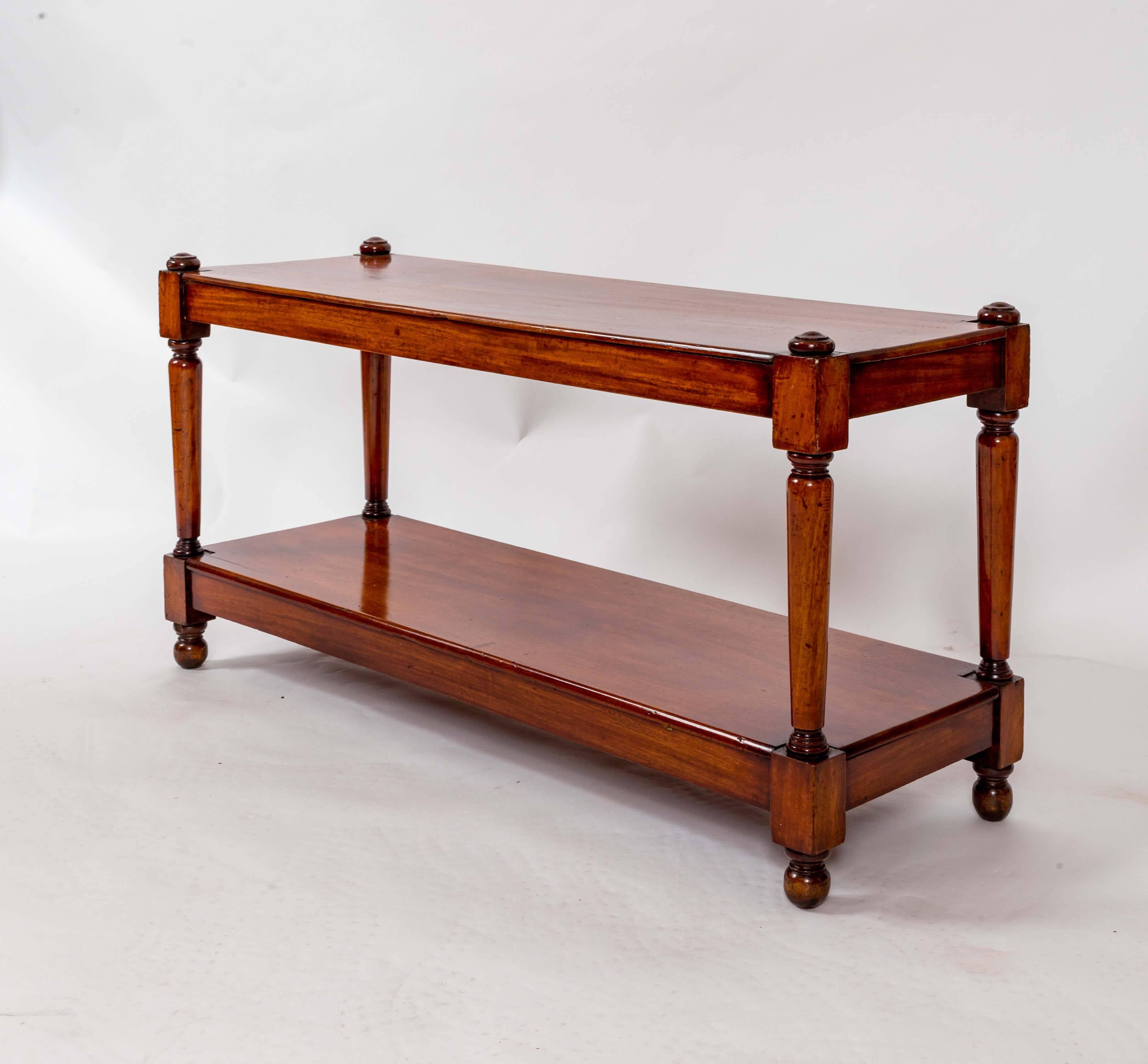 Narrow mahogany coffee or sofa table with barrel legs with turned finials.