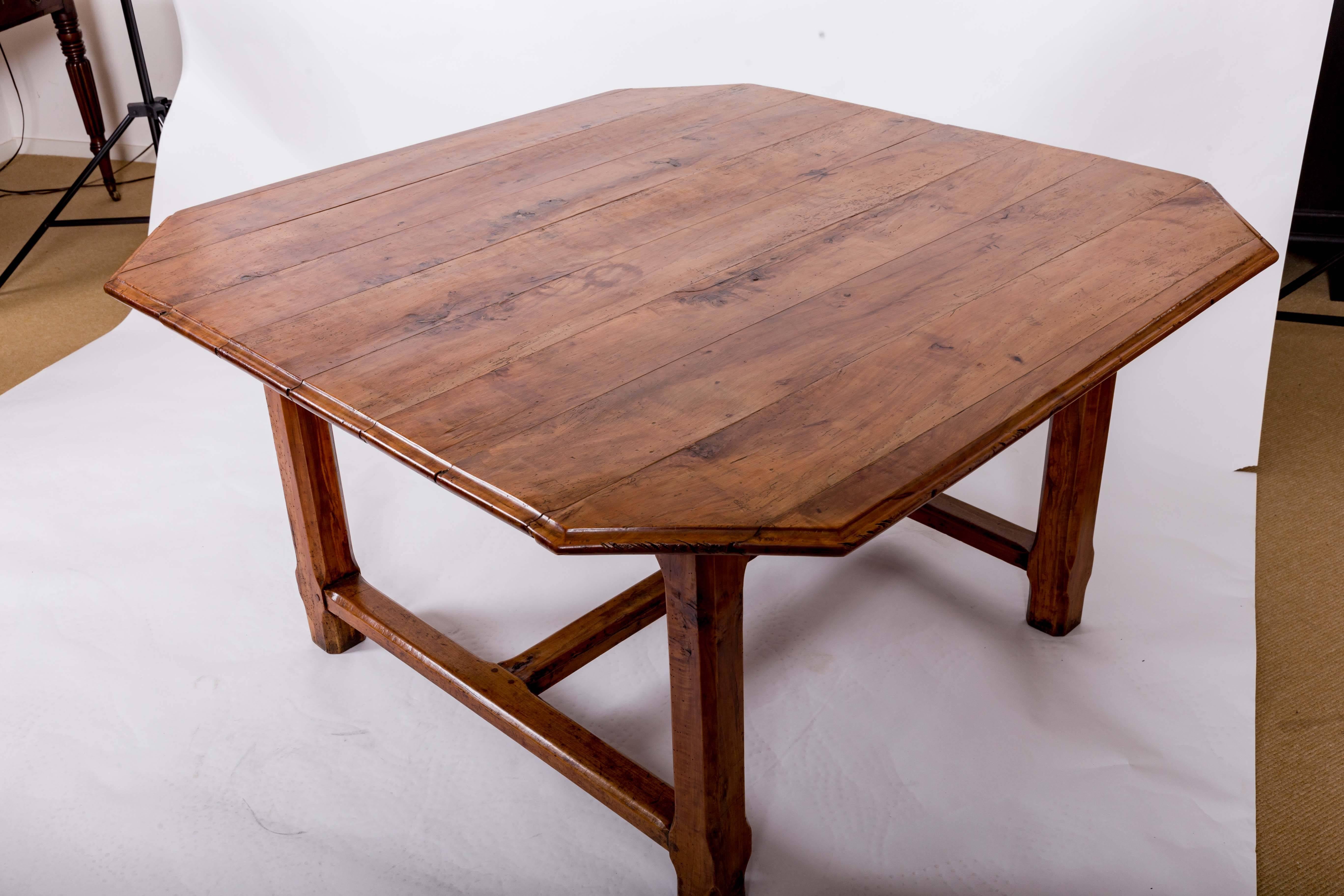 Square table with cantered corners, molded edge, one full length drawer with original turned knob, square cantered legs with cross stretching. Originally used vineyard tasting table from Bordeaux. Seats eight.