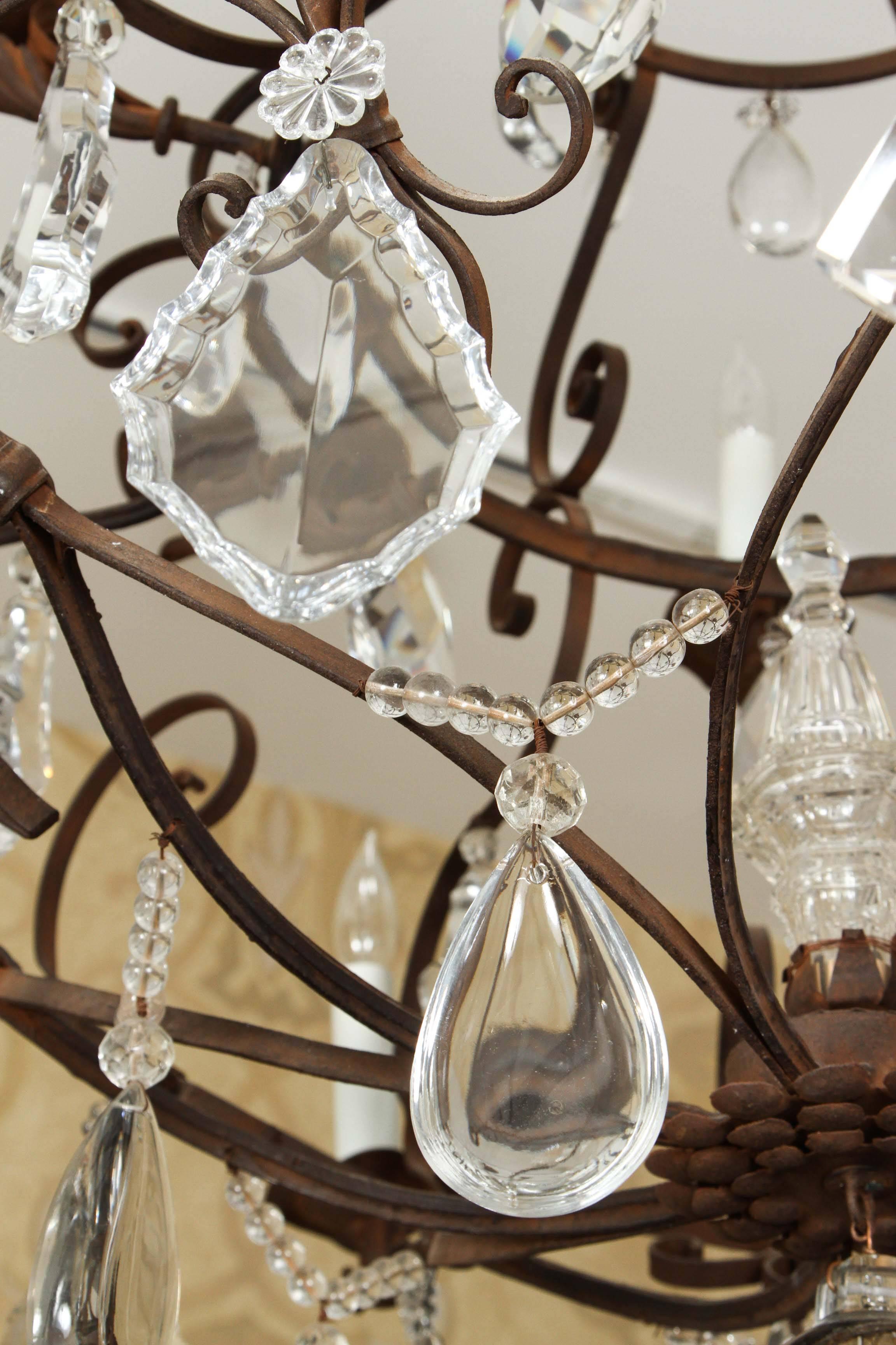 Grand Fourteen-Light Iron and Crystal Chandelier For Sale 2