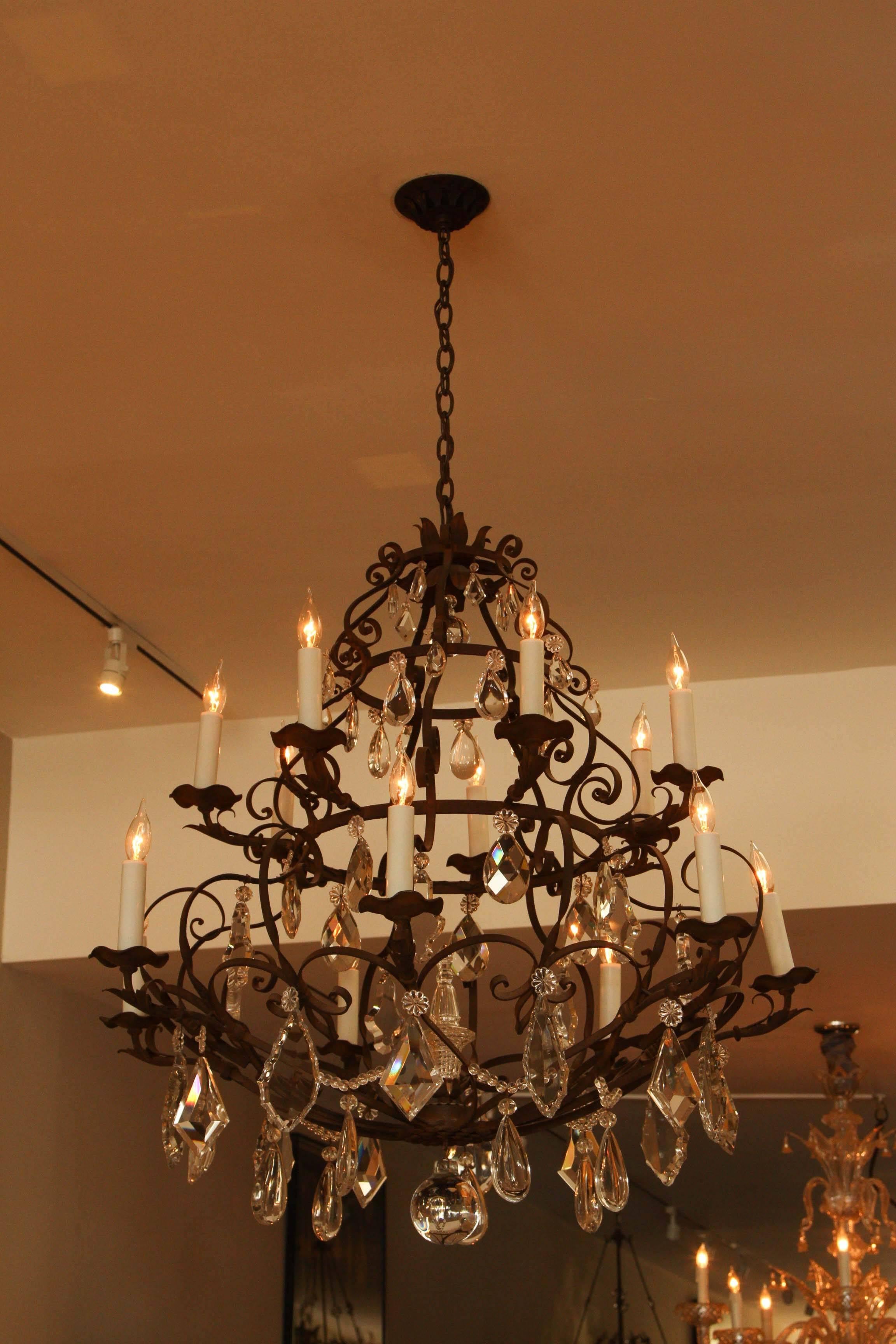 Grand Fourteen-Light Iron and Crystal Chandelier For Sale 5