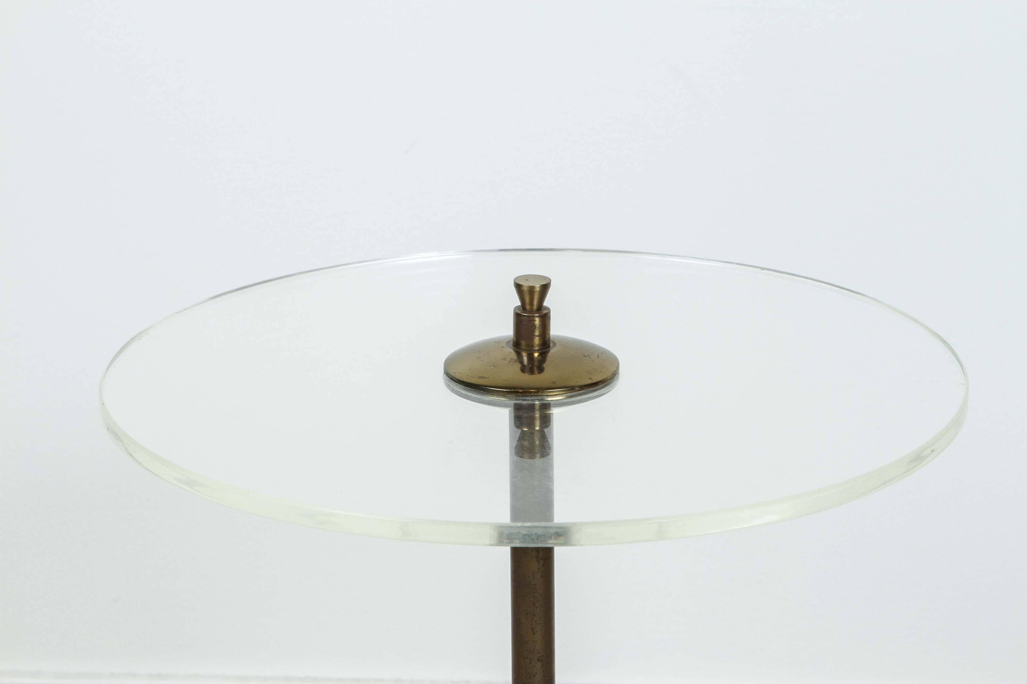 Italian Lucite and brass cigarette table.