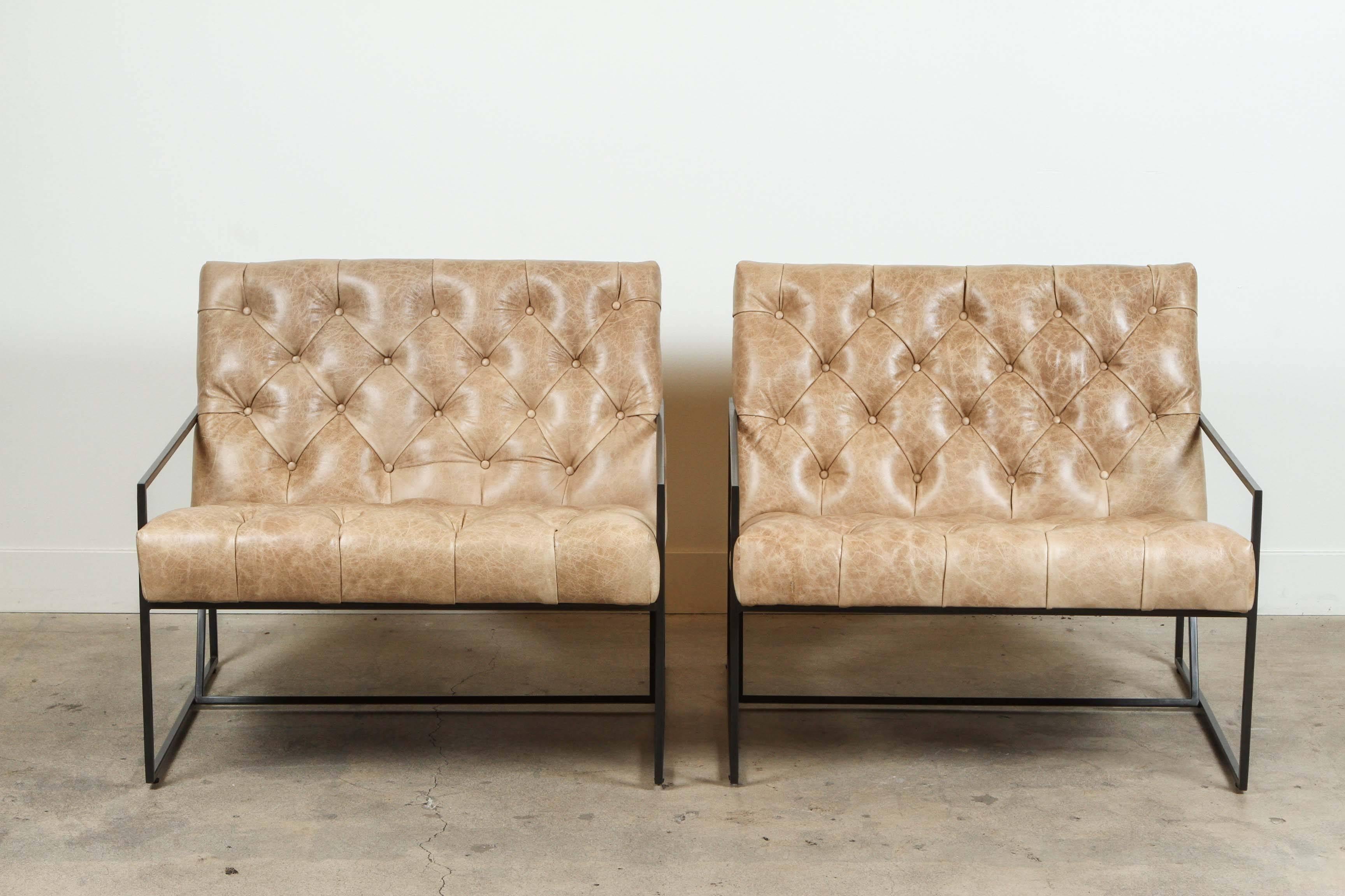 Pair of tufted thin frame lounge chairs by Lawson-Fenning in Vermont beige leather and matte black powder coat. Available to order in various finishes with a 8-10 week lead time. 

As shown: $5,312 pair. Available individually. 
To order: $3,800 +