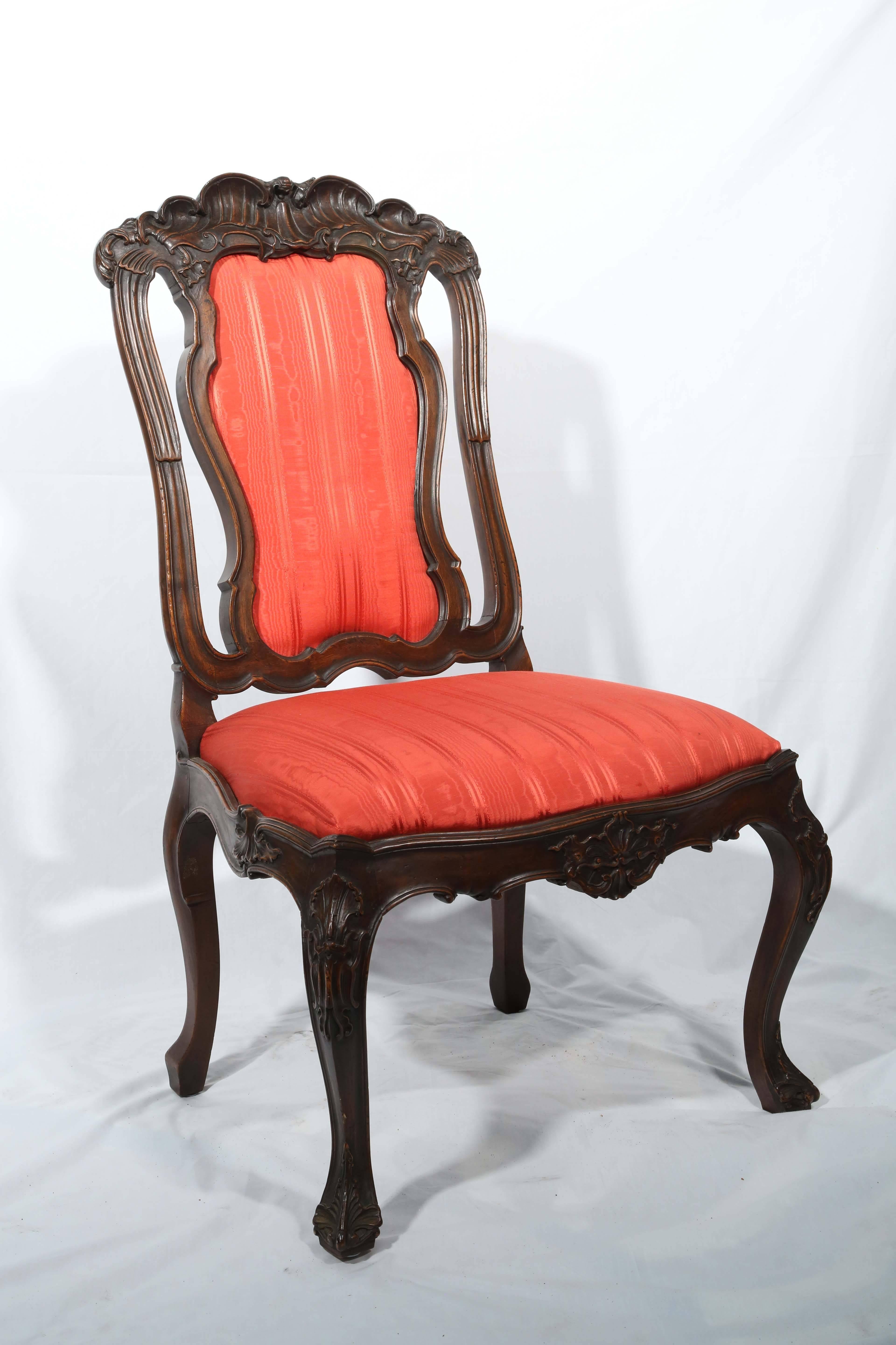 Wide seats, framed for comfort. Highly stylized, with Nouveau accents and shell-like carved 