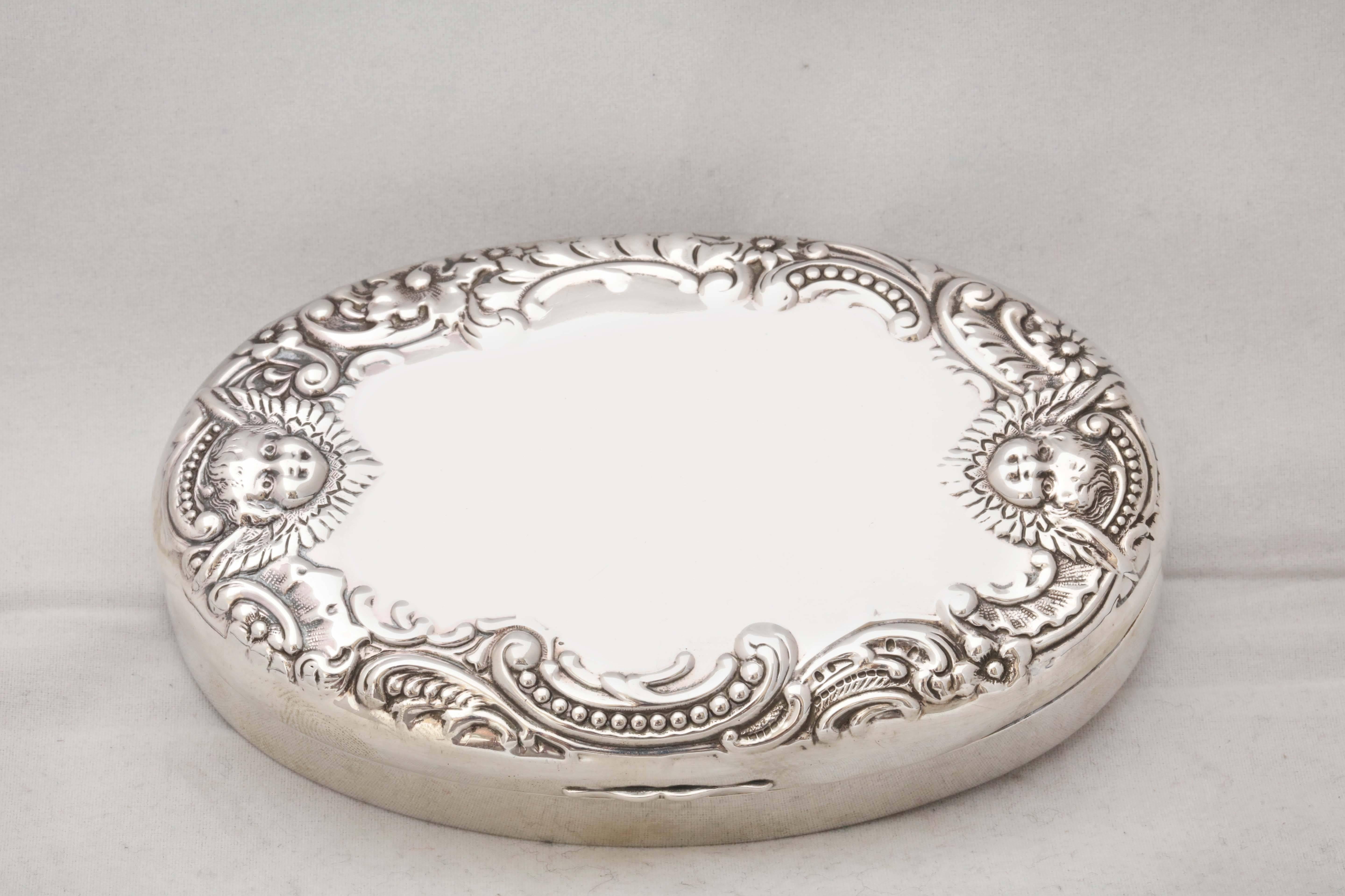 Sterling silver, Victorian trinkets or jewelry box with hinged lid, Dominick & Haff, New York, year marked for 1893. Hinged lid is decorated with swirls and a cherubs. Measures: 5