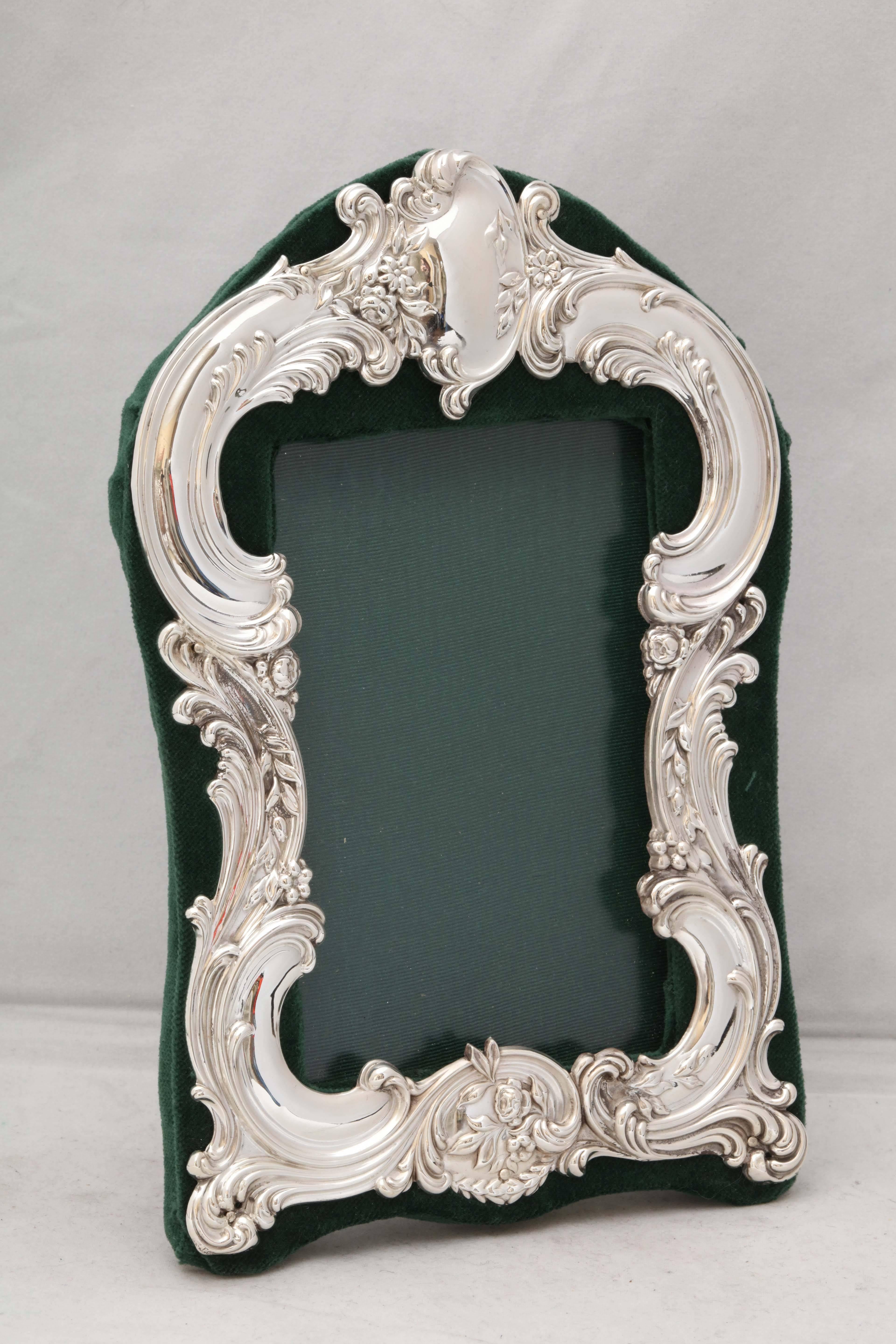 Victorian, sterling silver picture frame mounted on dark green velvet, The Gorham Manufacturing Corp., Providence, Rhode Island, circa 1895. Vacant cartouche; lovely swirls and flowers. Measures: 5 3/4