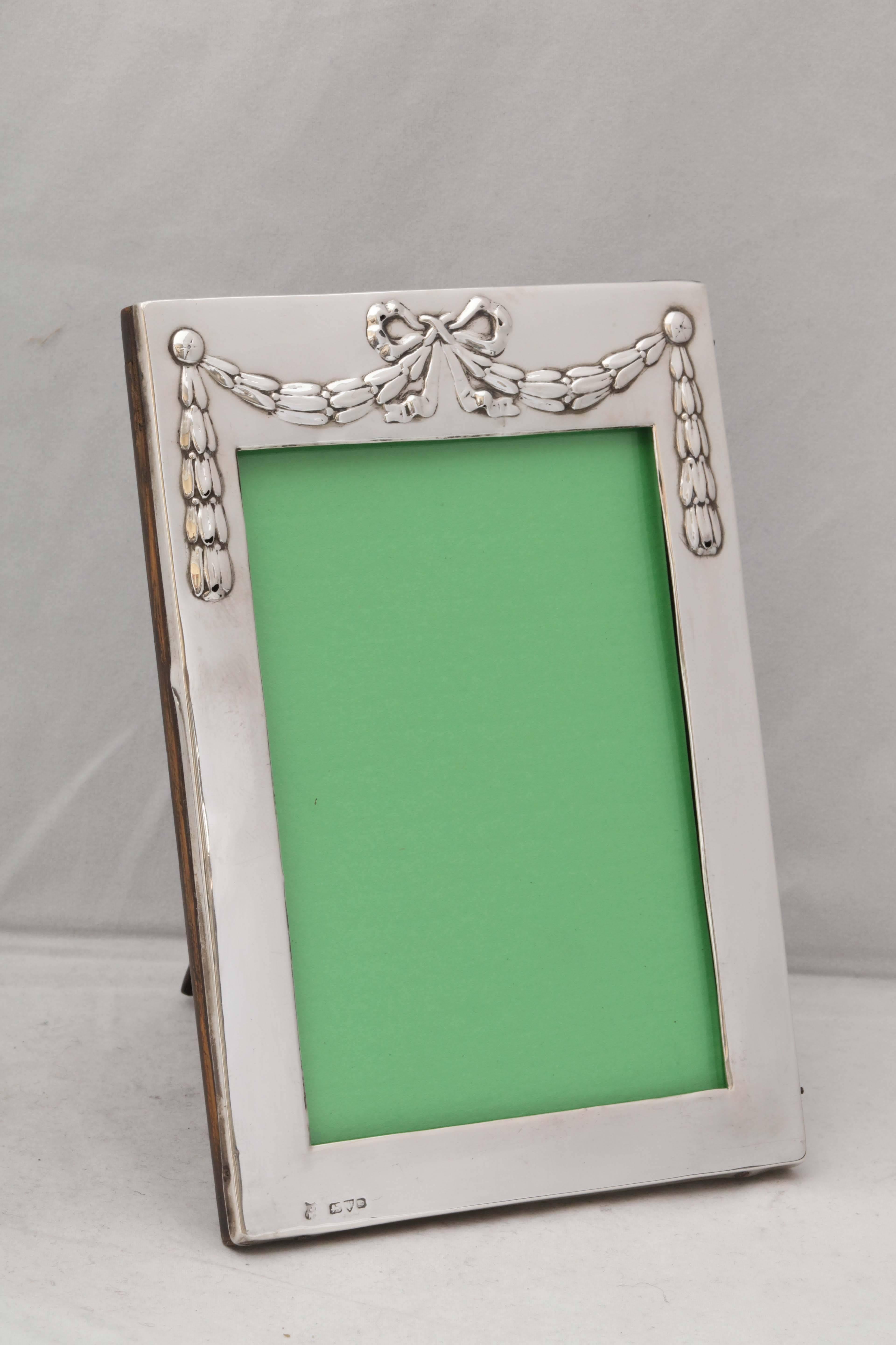 Edwardian, sterling silver picture frame, Chester, England, 1905, James Deakin & Sons - Makers. Frame is decorated with a large 