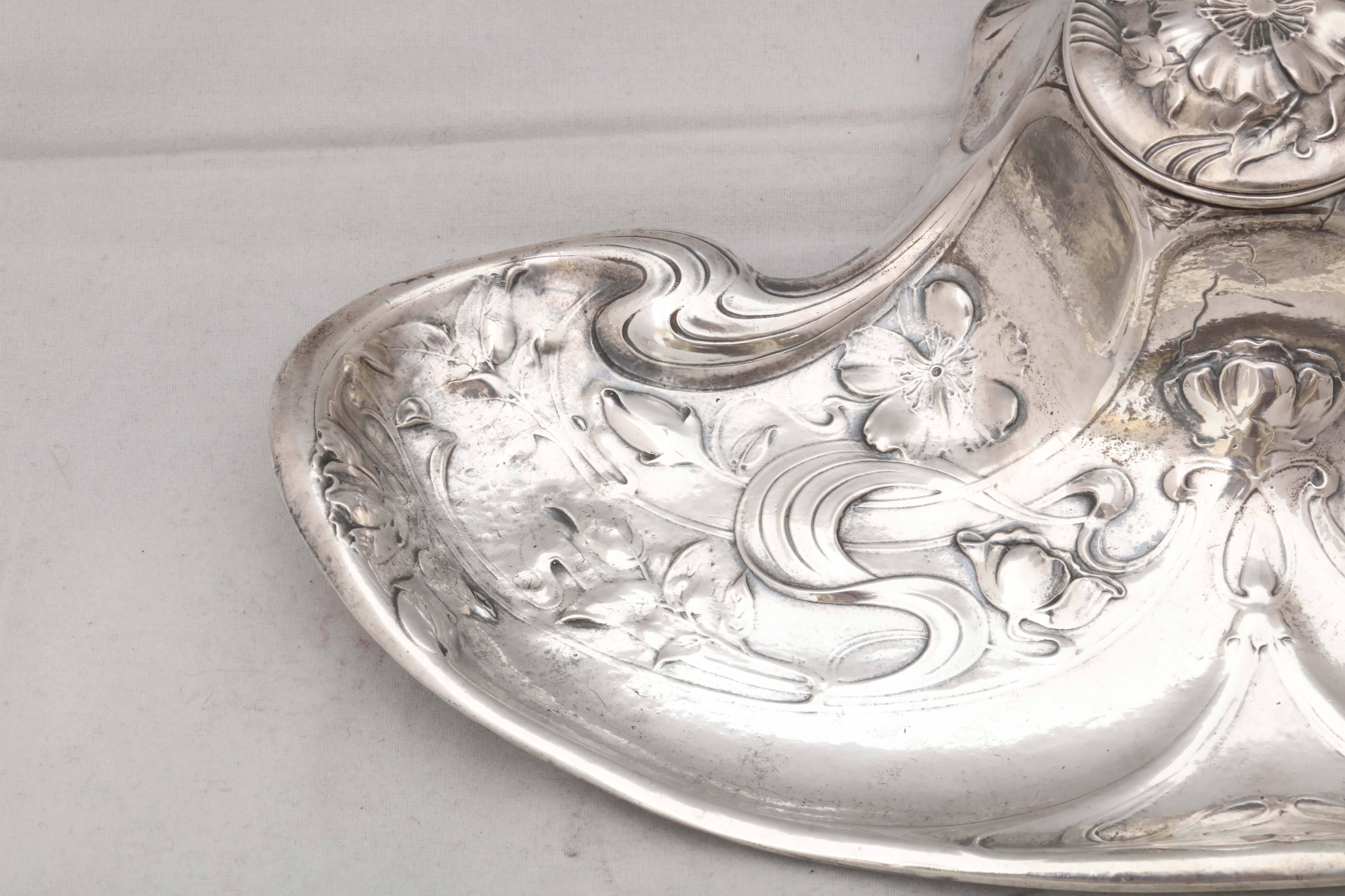 Fabulous, rare, sterling silver (.950) Art Nouveau, Martele inkstand with ball feet and hinged lid, the Gorham Manufacturing Corp., Providence, Rhode Island, circa 1905. According to the PTB mark on the underside, most probably, the Gorham