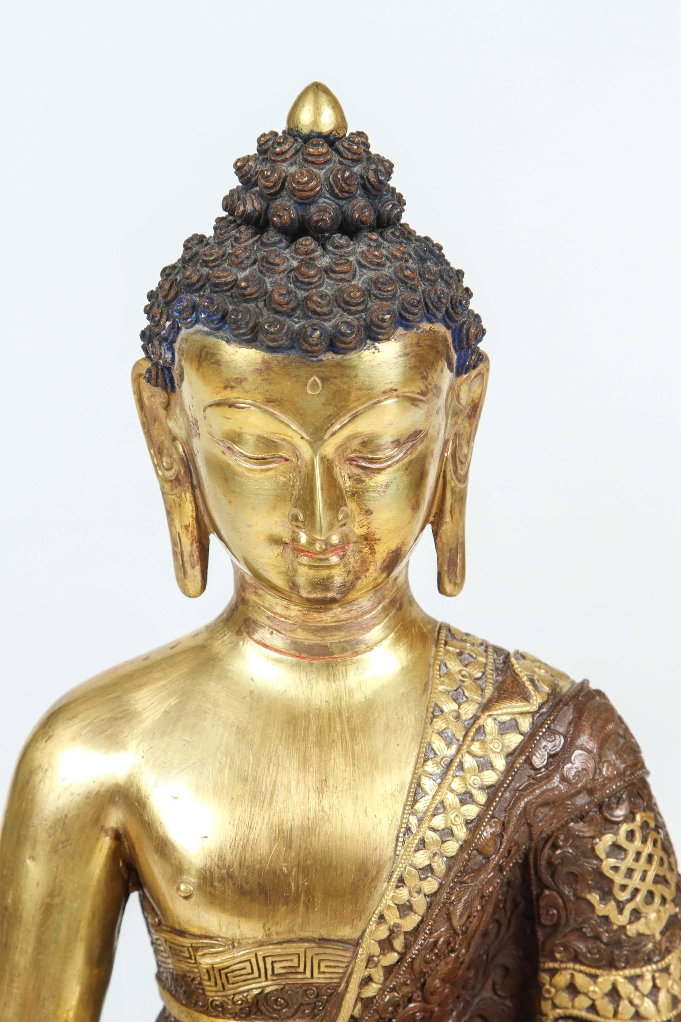 Brass Nepalese Buddha statue. Bhumisparsha Mudra.
Cast iron, handcrafted and handprinted with very intricate details
You can use it outside with no fear of rusting .
Add light and serenity to any interior or exterior. 
Seated in dhyanasana cross