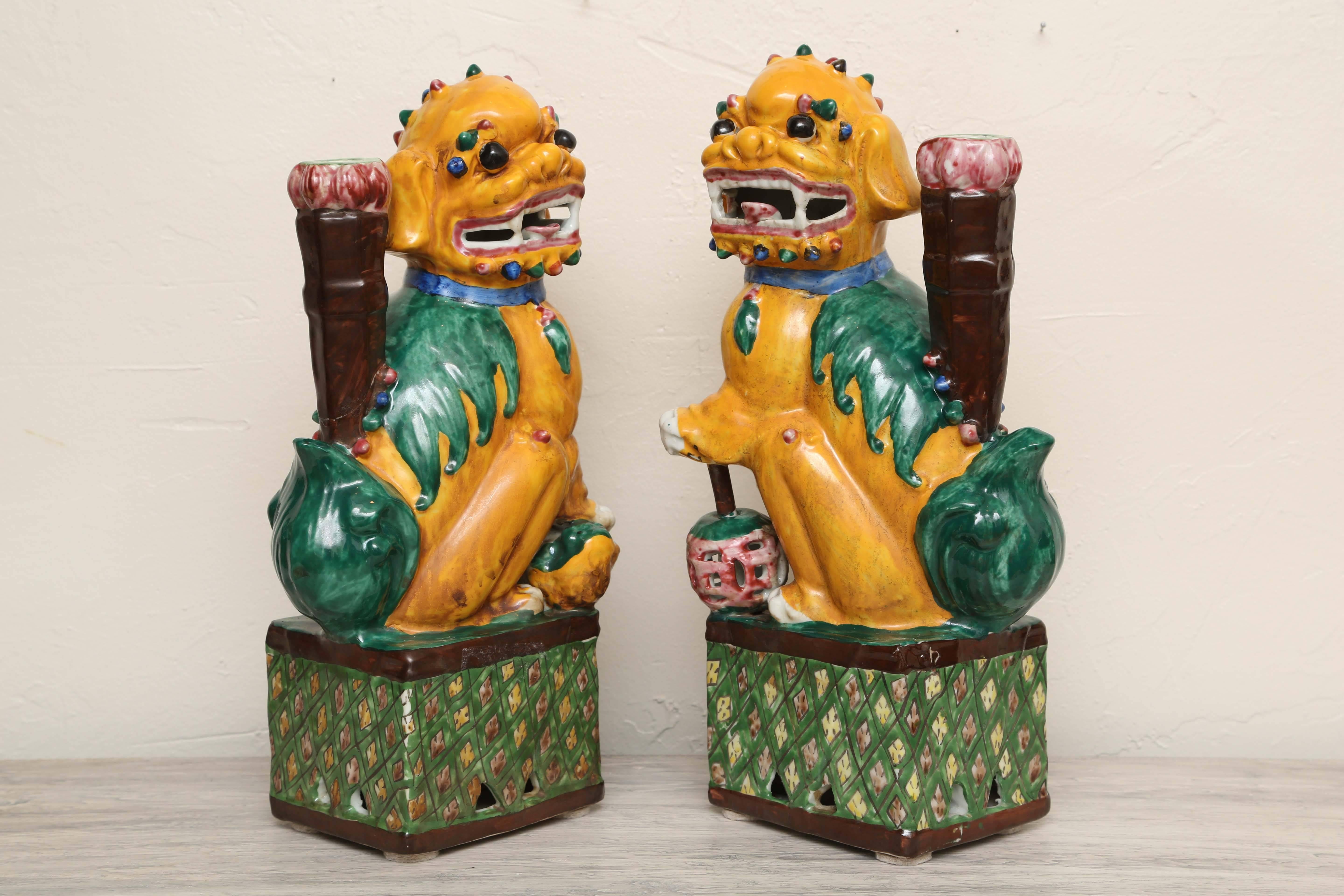 Exceptional and unique pair of late 19th century Foo Dogs. Done in beautiful, vibrant colors with great attention to detail.