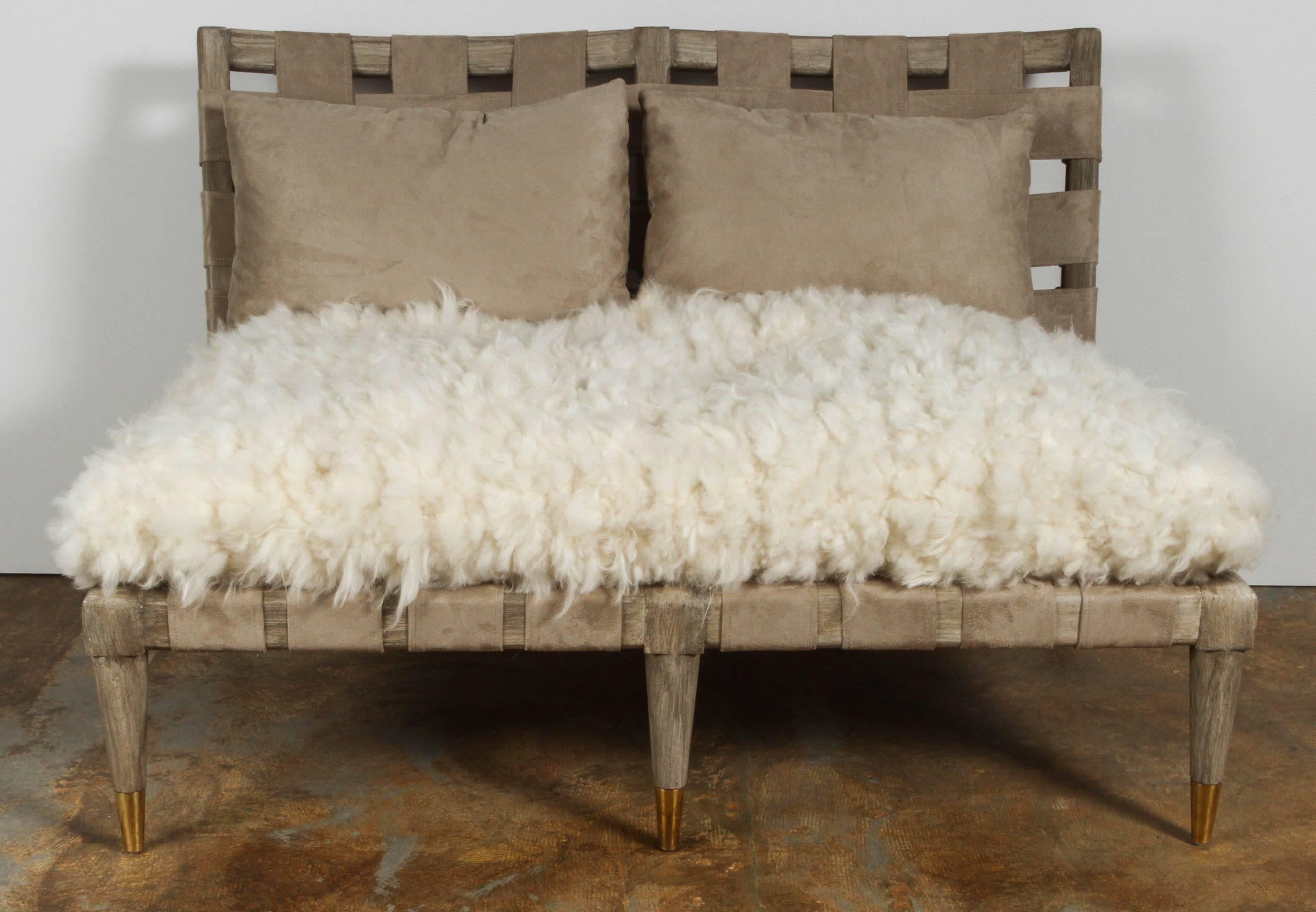 Mid-Century Modern settee sitting group with settee and chair. Totally restored with new finish, woven natural sheepskin from Denmark, custom-made ultra-suede straps and pillows (shown on settee), sabots with new unlacquered brass finish. 

Chair