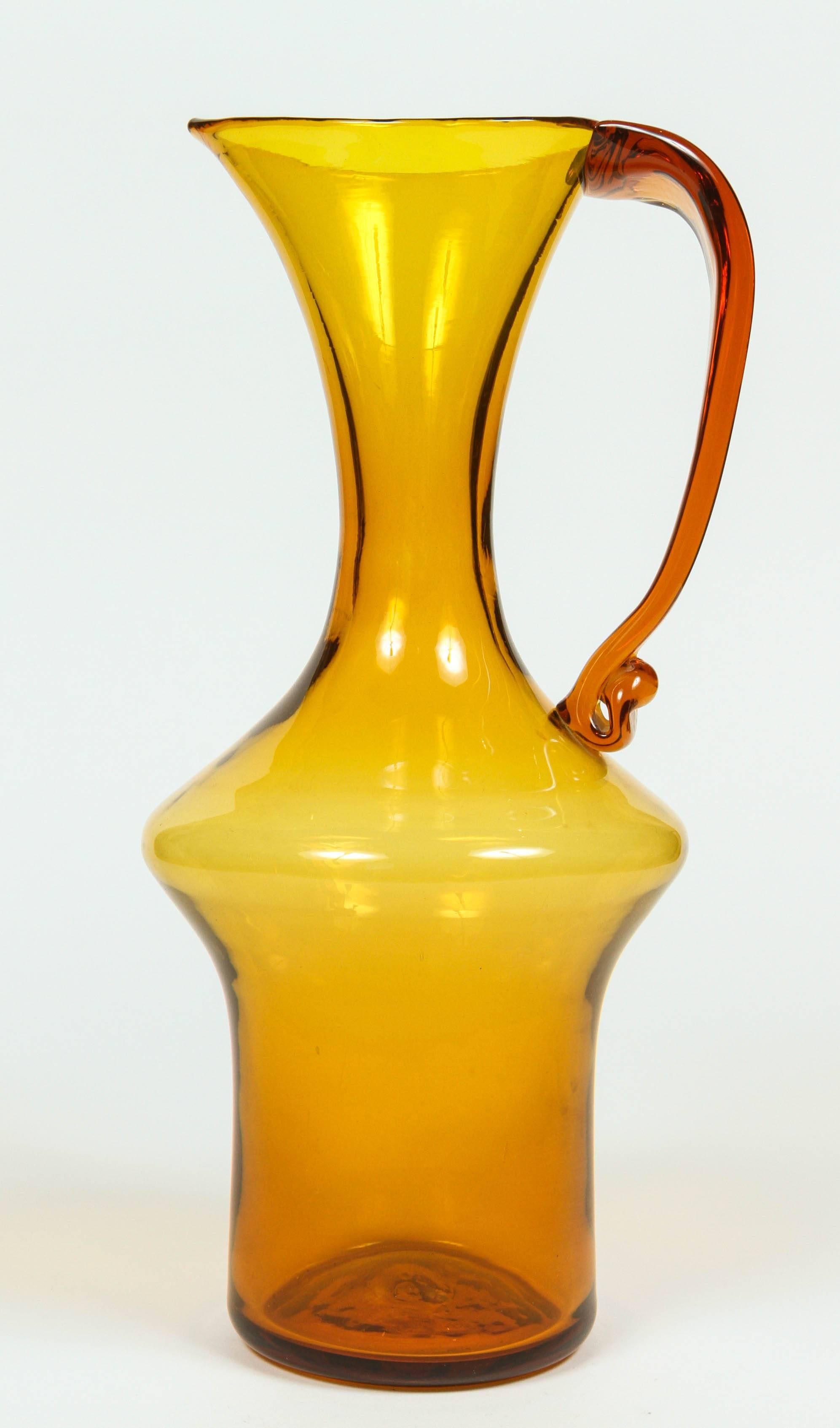 Large vintage Blenko handblown amber glass pitcher.