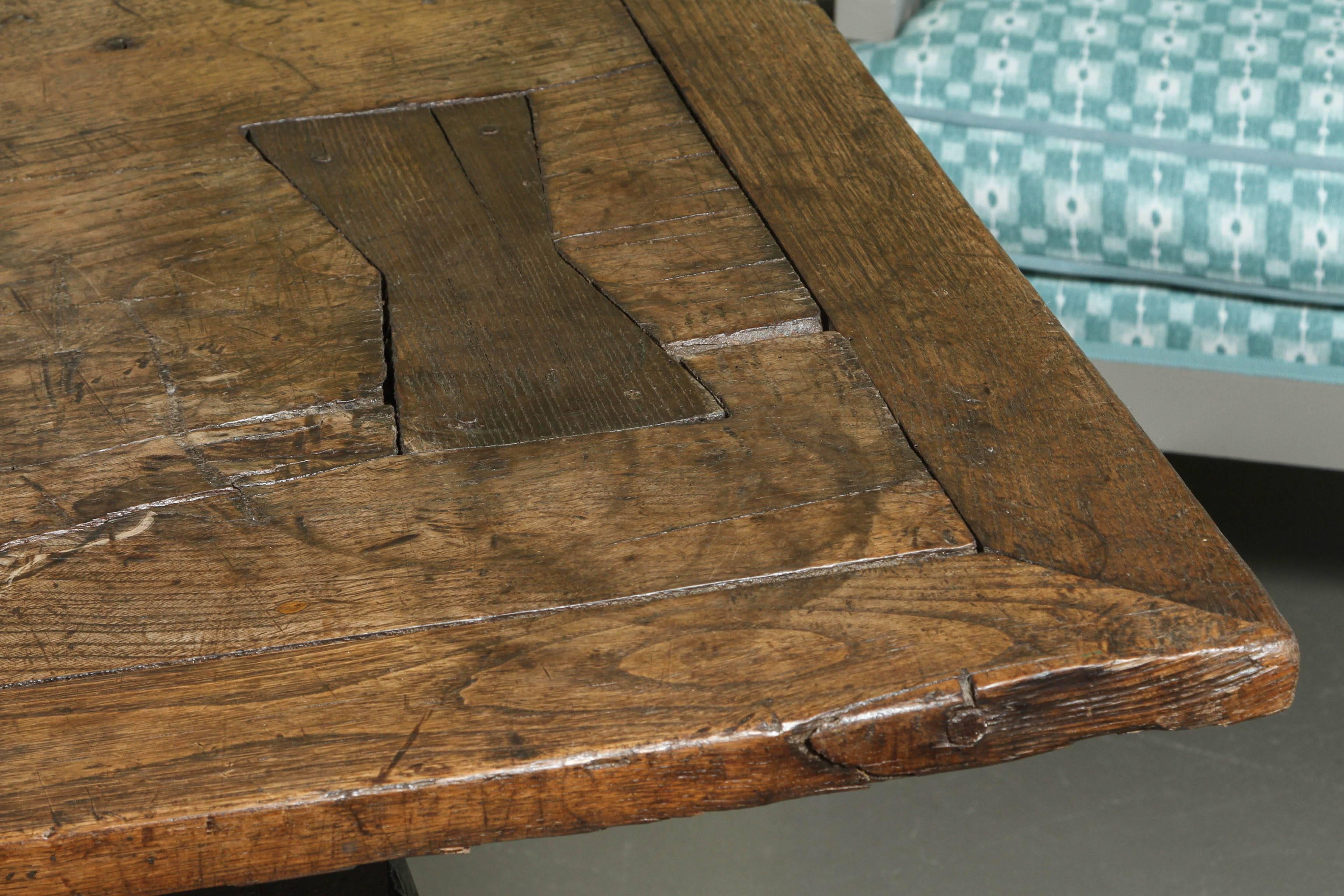 A large Portuguese oak table, circa 1700. A wonderful dining or center table. The oak has a beautiful patina.
