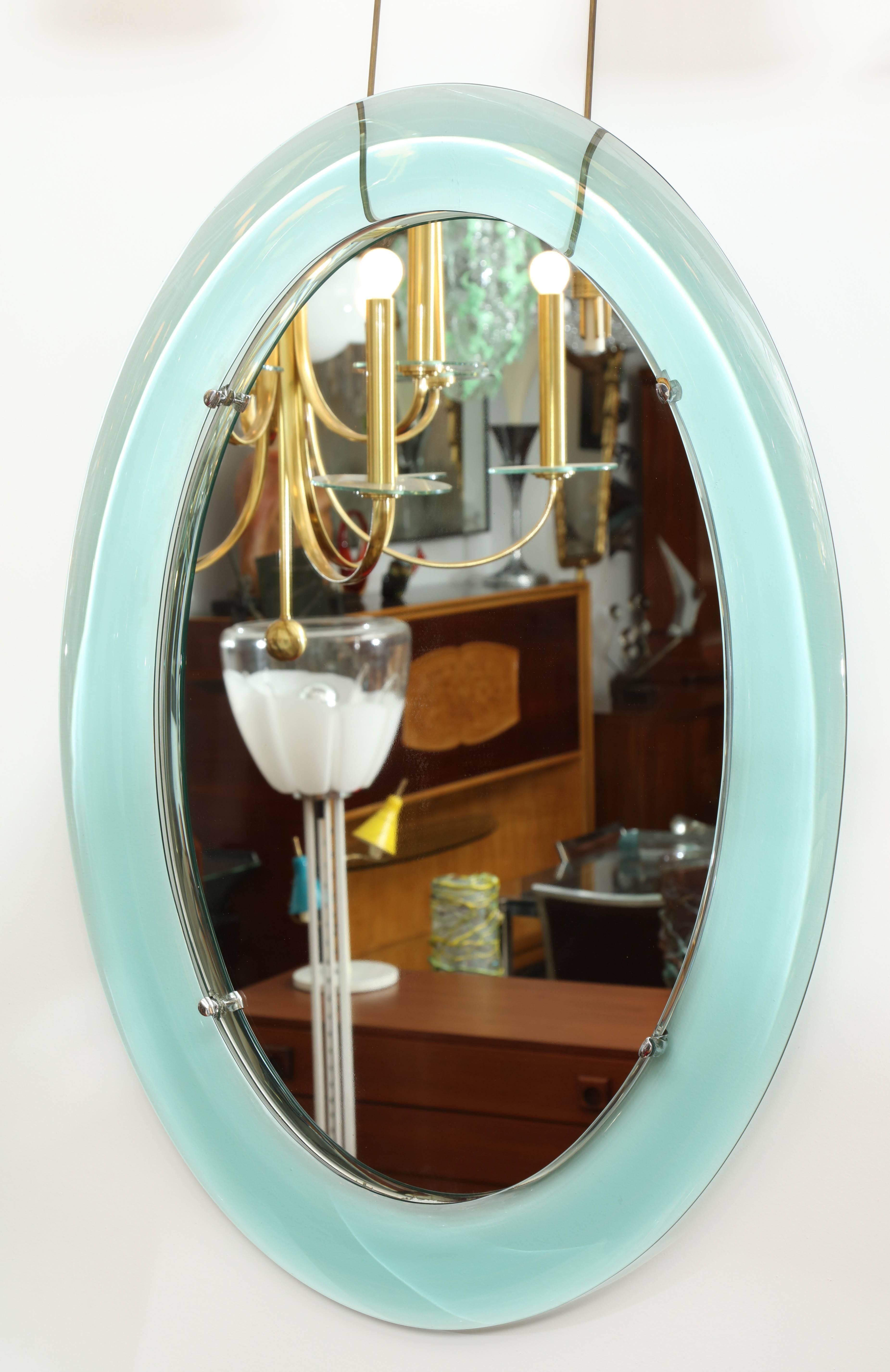 Stunning large oval crystal Arte mirror made in Italy 1960, curved green glass frame with a recessed mirror, unusual model, great quality.
 