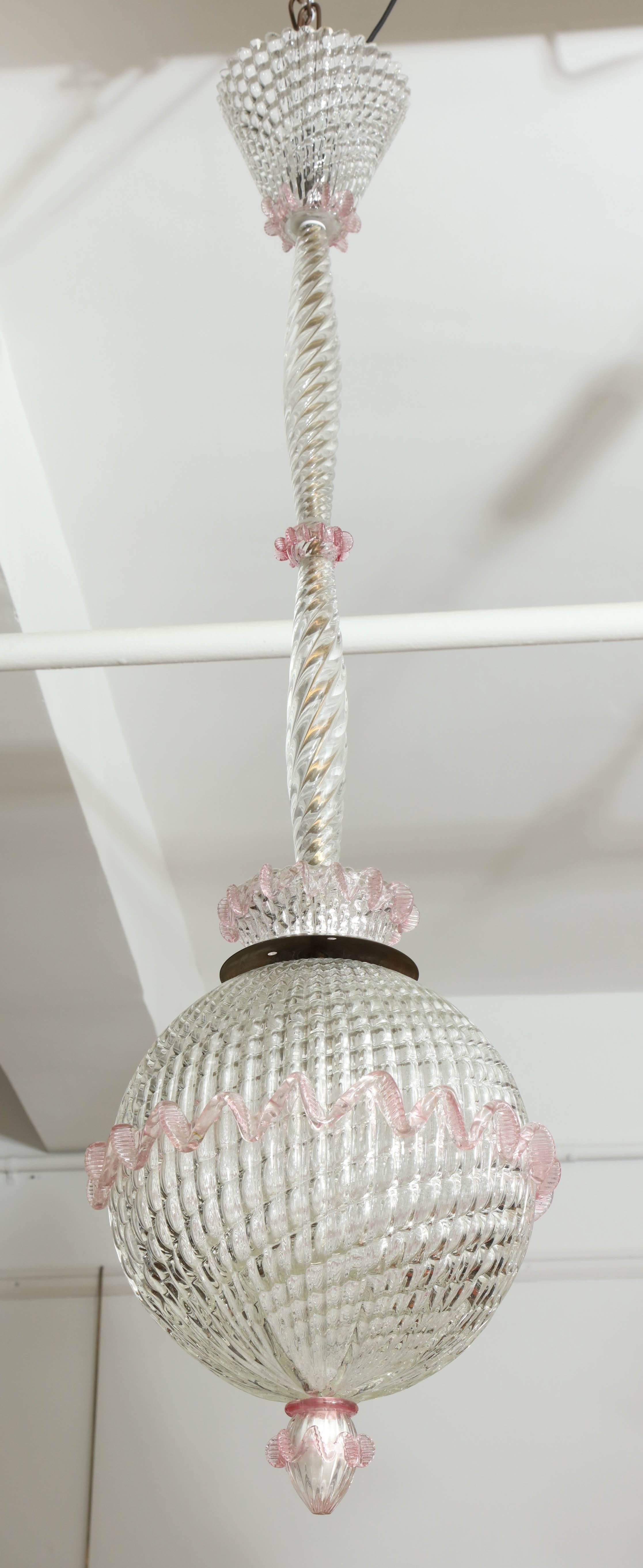 Stunning pendent light made in Venice 1945-1950 by Barovier & Toso, blown glass in a swirl pattern on the shade, stem and canopy with a rose colored glass trim, beautiful form, great quality, very unusual, takes one incandescent bulb.
 