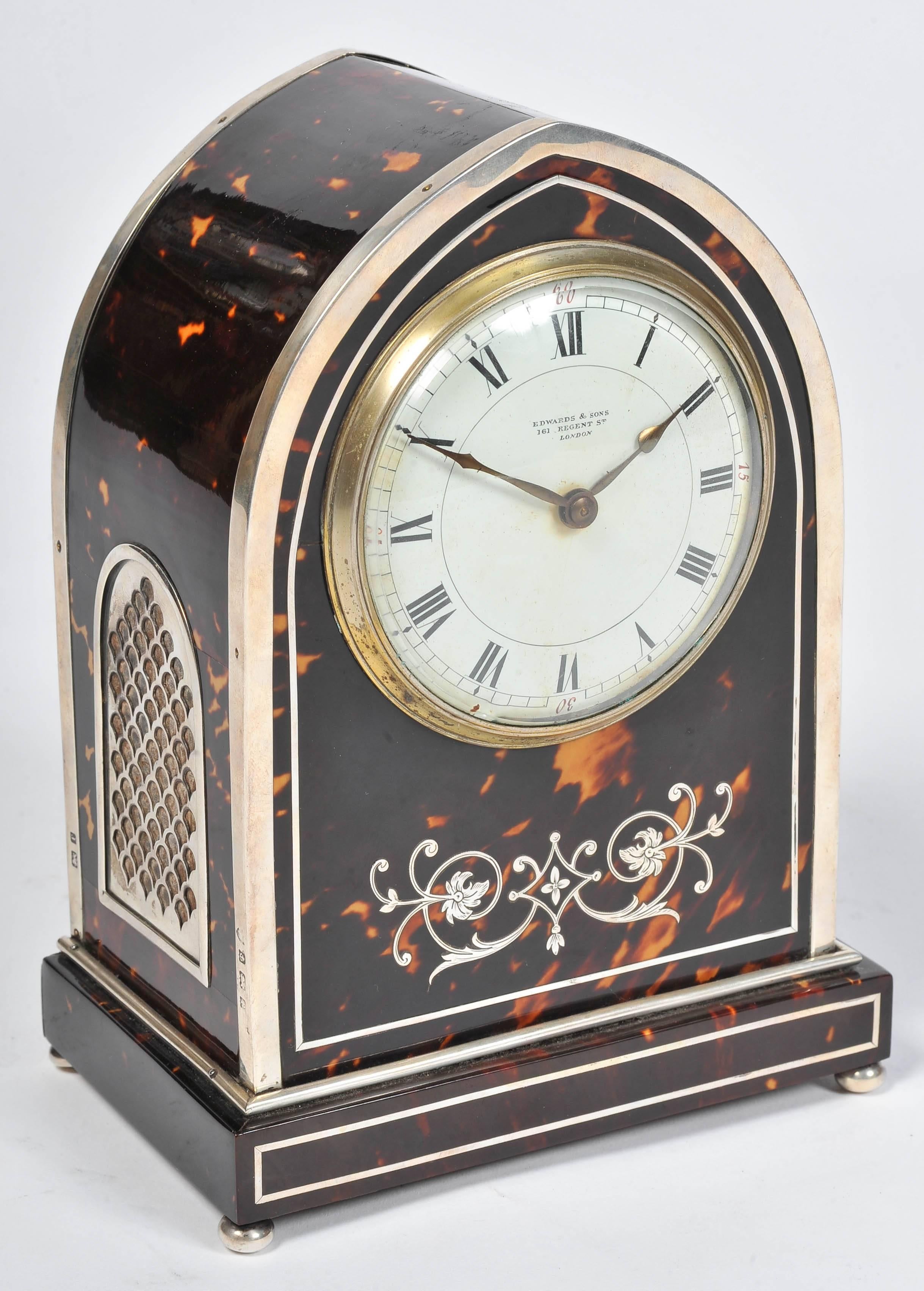 A fine quality English silver mounted and inlaid tortoiseshell mantel clock, in the Gothic style.
'Edwards & Sons
163 Regents Street,
London.
 