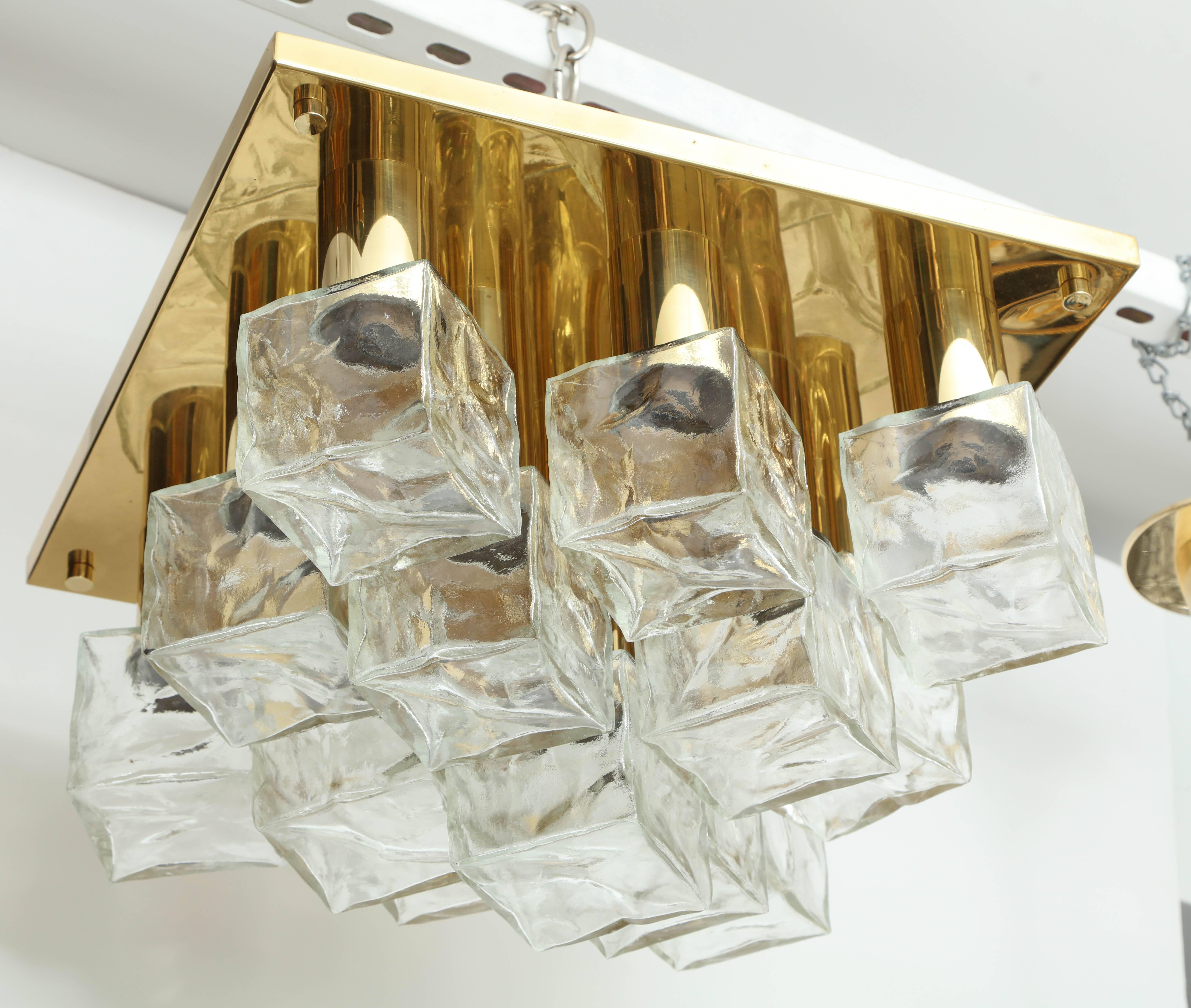 Scandinavian modern Classic flush mount featuring 13 ice cube elements suspended on a polished brass backplate. Rewired for use in the USA, uses chandelier type bulbs.