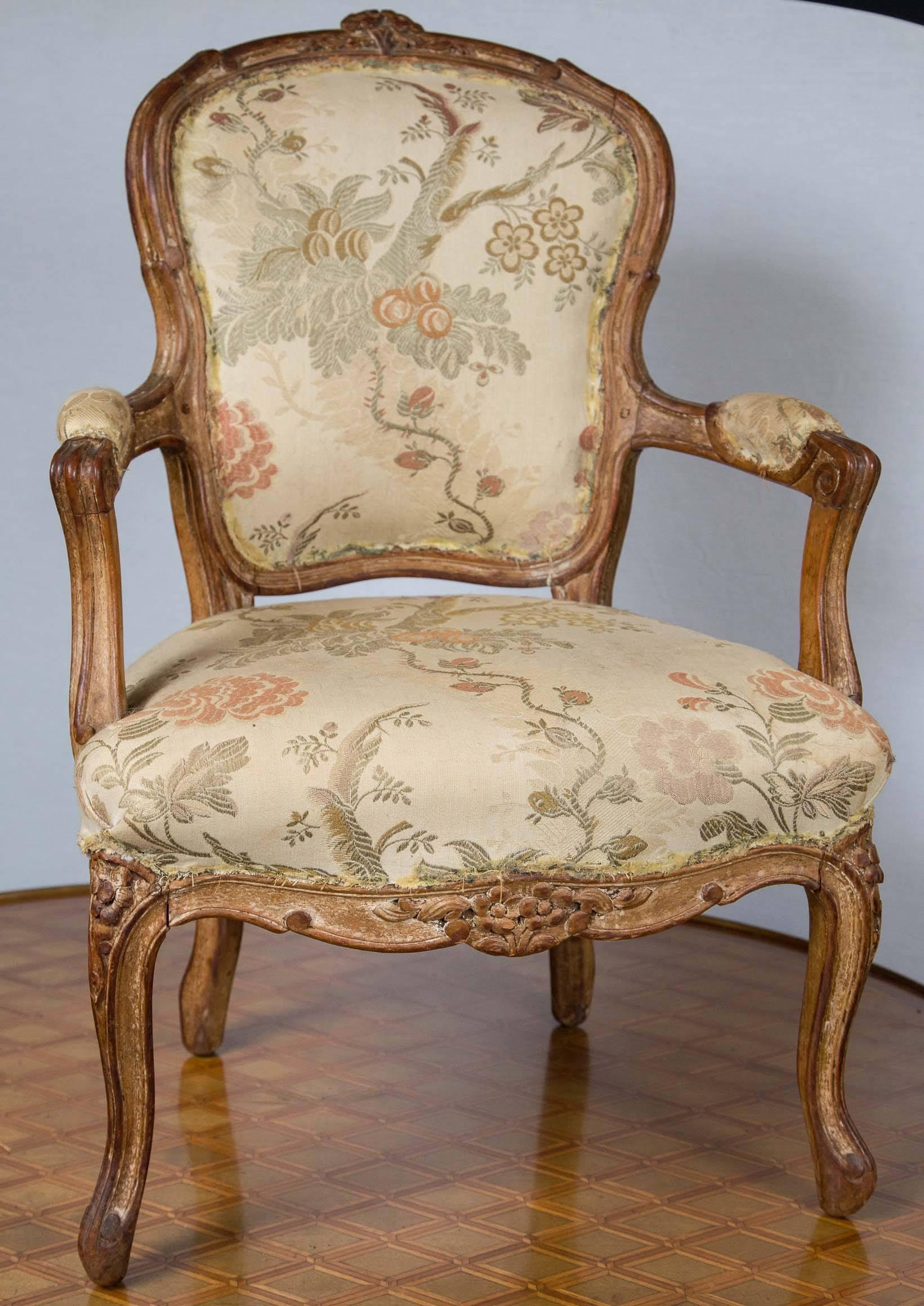 Worn paint, antique fabric and beautiful simple carvings make this rare open armchair very special. Fully pegged, braced back, arched top, padded arms and cabriole legs.
Something very special for the collector or designer.