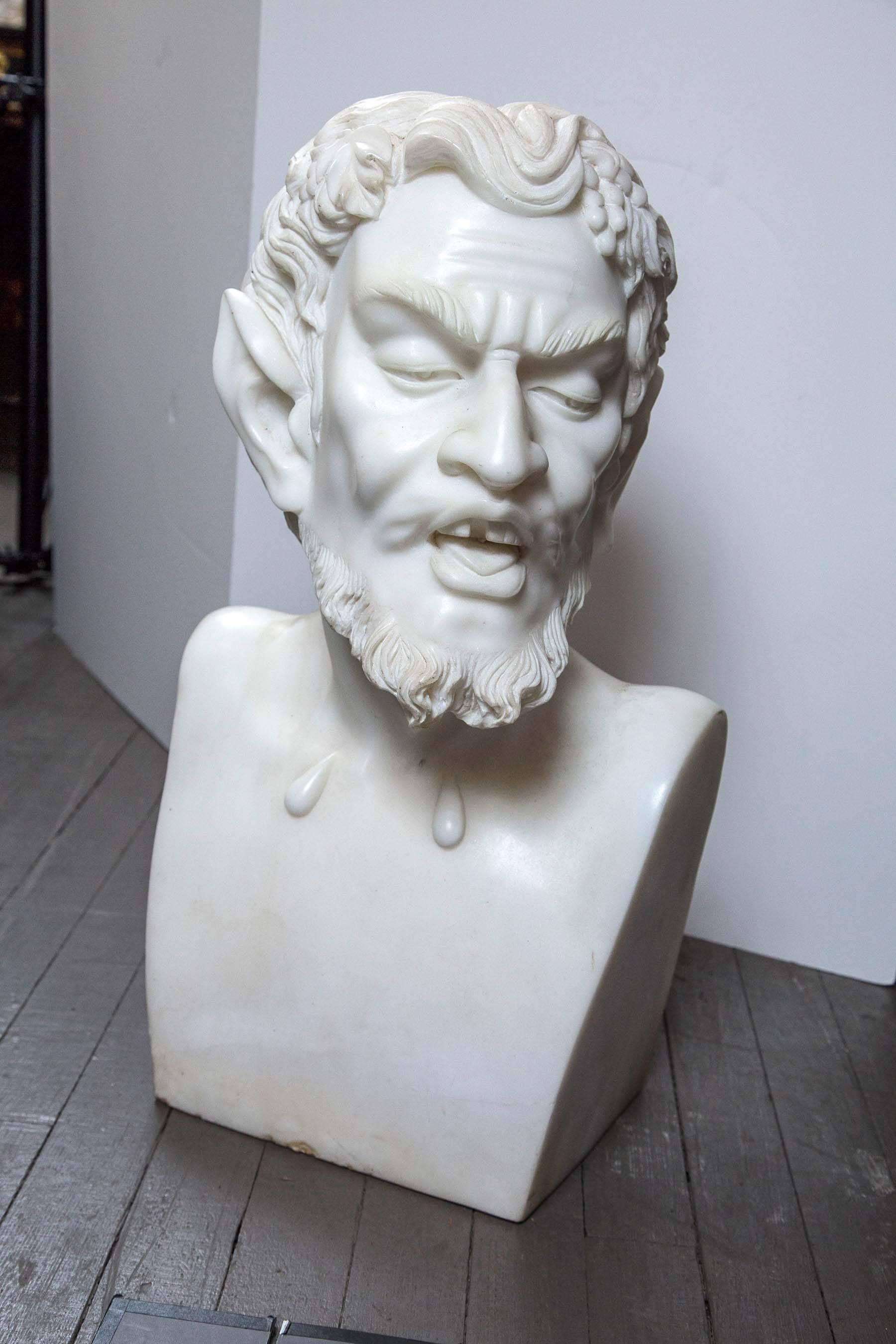 Just in time for Halloween, a well carved white marble bust of the Satyr, complete with pointed ears. Bunches of grapes and some grape leaves decorate his hair.
The depth includes his bearded chin.
He is very heavy.