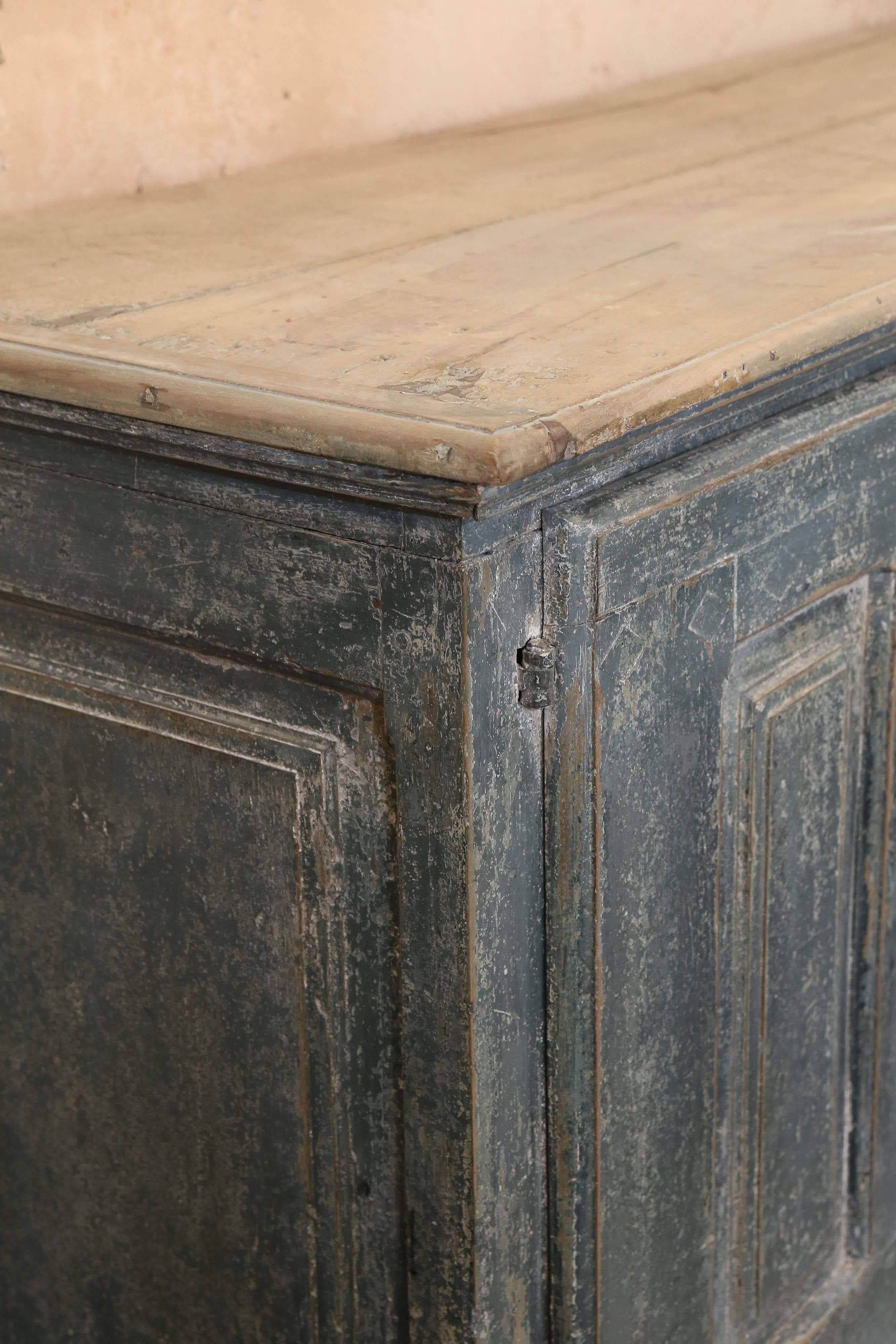 Large painted two-door cabinet. Stripped finish on top with heavy original hardware on the doors. Great proportions and patina.
