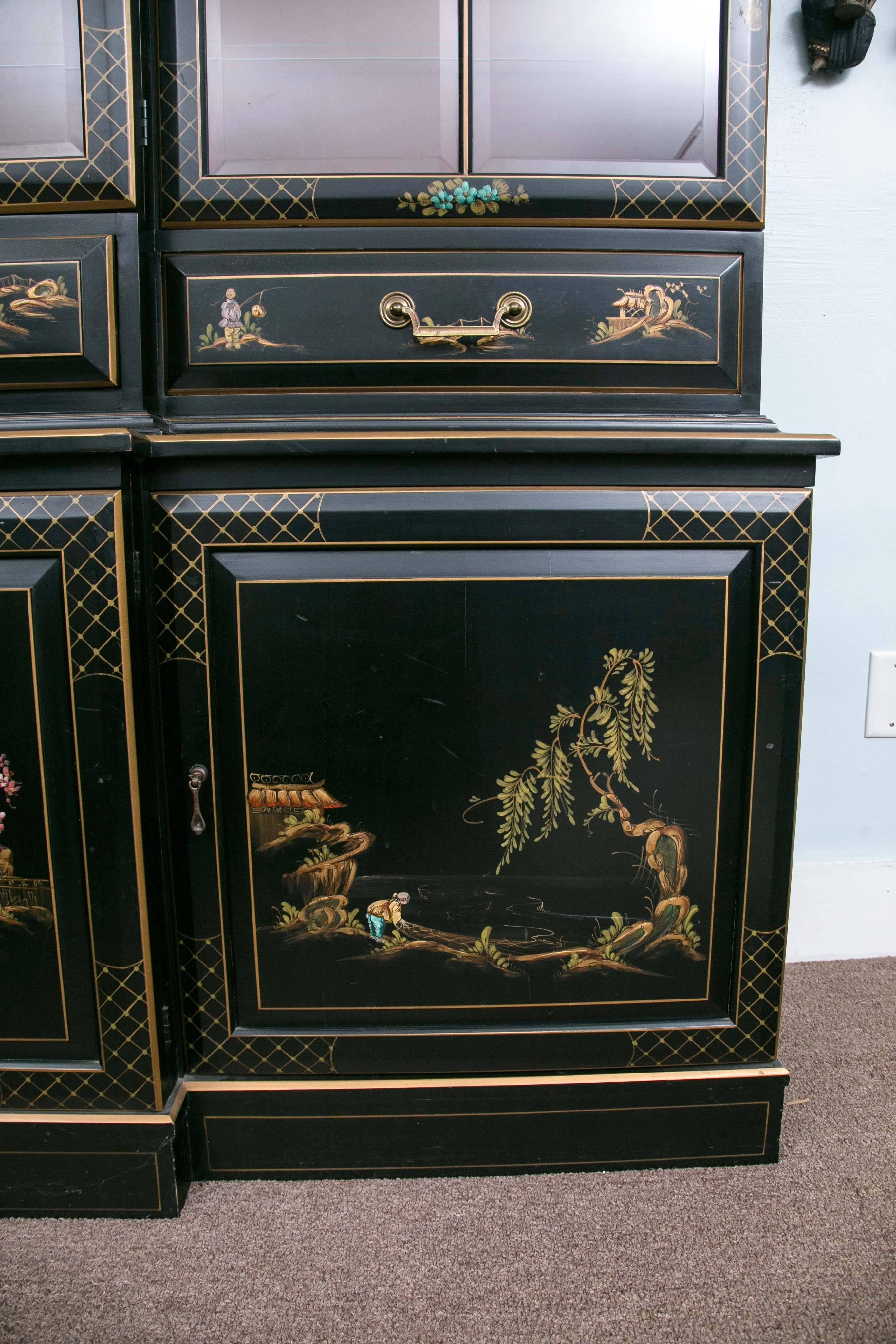 George III style Chinoiserie decorated black Japanned breakfront/bookcase. Beautiful Chinese Chippendale style library/dining room breakfront. Fabulous Feng Shui red lighted interior. Red being the color of Feng Shui Fire element, representing