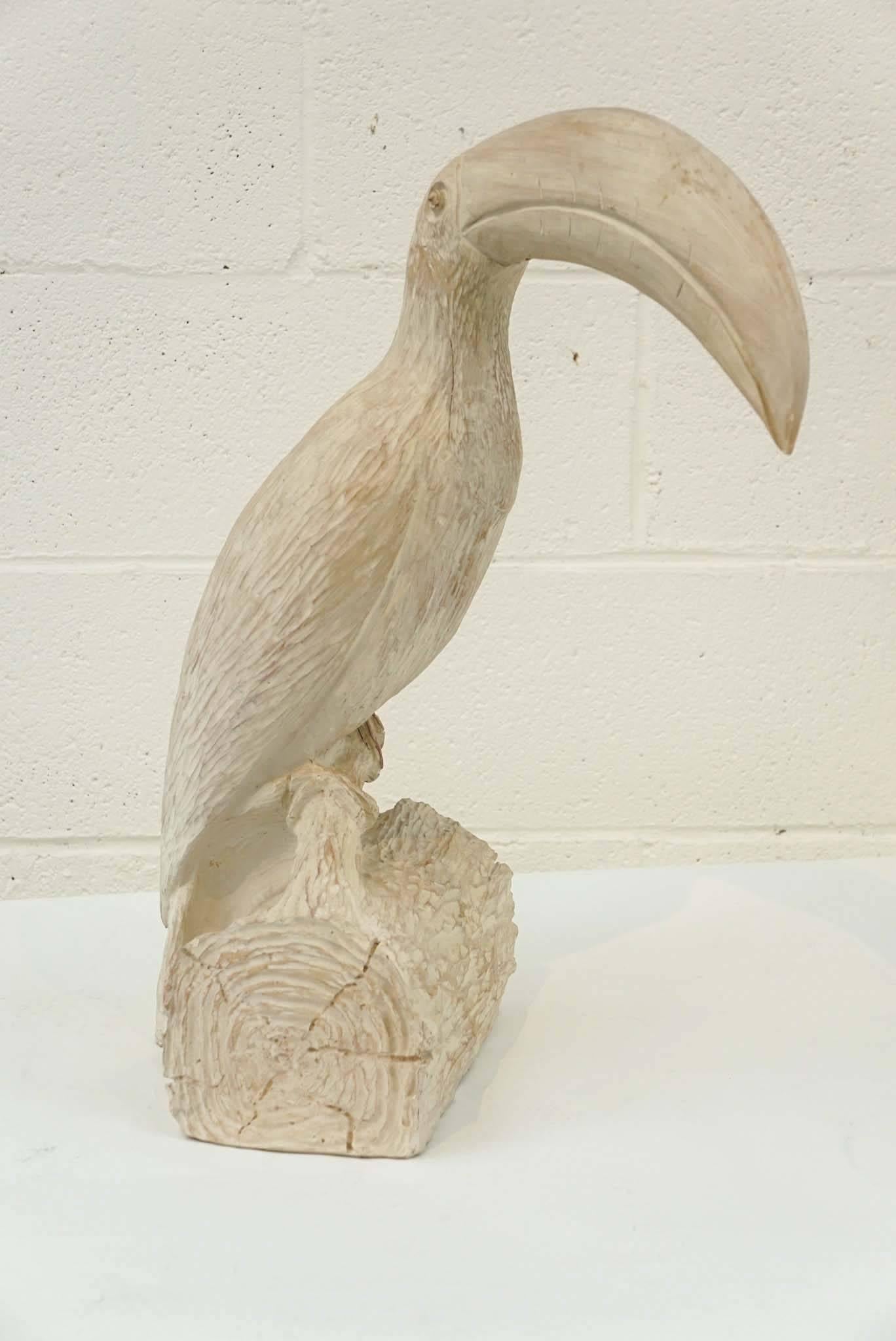 Here is a great toucan sculpture sitting on it's perch. Hand-carved in wood, the stump of wood has a carved faux bois quality.
 